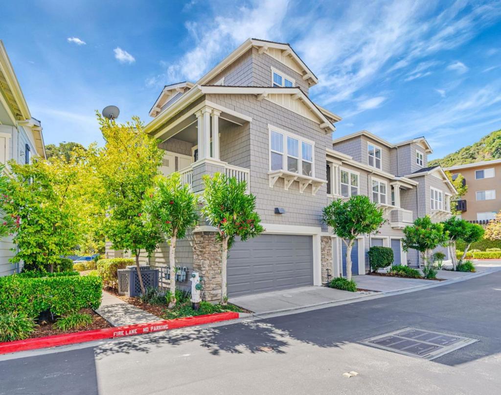 Bright and gorgeous end unit Townhome in the desirable Belmont Cambridge community. 2 bedrooms, 2 balconies, 2.5 baths, 2-car side-by-side garage. Living room welcomes you with an abundance of sunlight. Smooth flow between indoor and outdoor space as you walk out to dual balconies. Updated Kitchen boasts porcelain tiled floors, stainless steel appliances, white cabinets w/granite countertops. Newly updated flooring in the dining room and living room. Hall bath updated w/ porcelain tile, white cabinets , and marble countertops. Updated primary bath w/porcelain tile, white cabinets, quartz countertops, porcelain tile surround in the shower and mosaic floors. Excellent schools Cipriani Elementary, Ralston middle & Carlmont High. Community pool, hot tub, playground & ample guest parking. Close to walking/biking trails & Waterdog Lake! Minutes to the grocery store, Starbucks and Carlmont high etc. Easy Access to Interstate 280 and Highways 92 & 101.Welcome home!