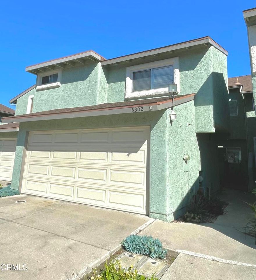 Don't miss out on this cozy two-story townhome with an open and spacious floor plan. The large living area features a vaulted ceiling, while the kitchen is updated with stainless steel appliances, making it perfect for cooking up your favorite meals. The home also boasts upgraded wood-like flooring and an indoor laundry area. Attached to the house is a two-car garage with direct access, providing ample space for your vehicles. An assigned parking spot is also included within the unit. The spacious backyard is ideal for relaxation and barbecues. Additionally, you'll appreciate the nearby community swimming pool, which offers a refreshing escape during the summer months. It's conveniently located just minutes away from the beach, naval base, and shopping. This townhome is a must-see!