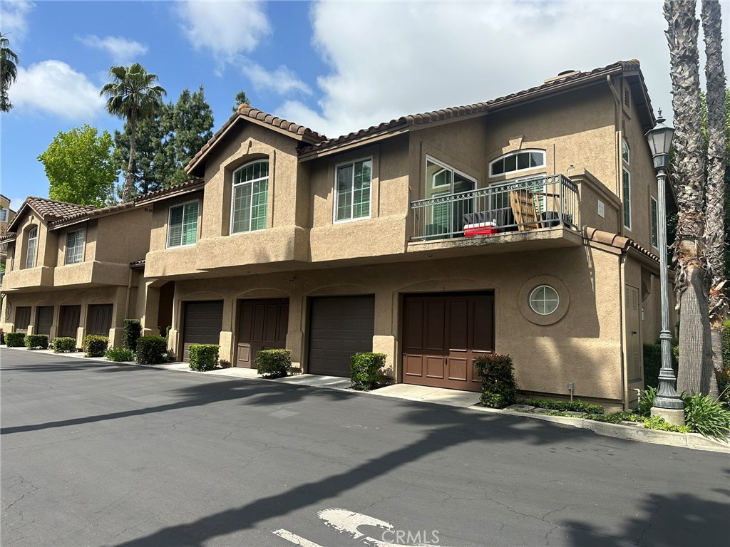 This is a spacious single level first floor 2 bedroom and 2 full bathroom townhome with a direct access attached garage. Plenty of windows to bring in the natural light. The living room has a gas/wood burning fireplace, a separate dining area that has a walk out patio. The large kitchen has lots of counter space. Warm Laminate flooring in most of the house. The bedrooms are carpeted and the master bedroom has mirrored closet doors. It also includes a large laundry room and includes washer and dryer. The direct access to the garage includes storage. Centeral gas heat and Central A/C. The community includes a large swimming pool, spa and bbq area. Located in great part of the tract. You will love this one.