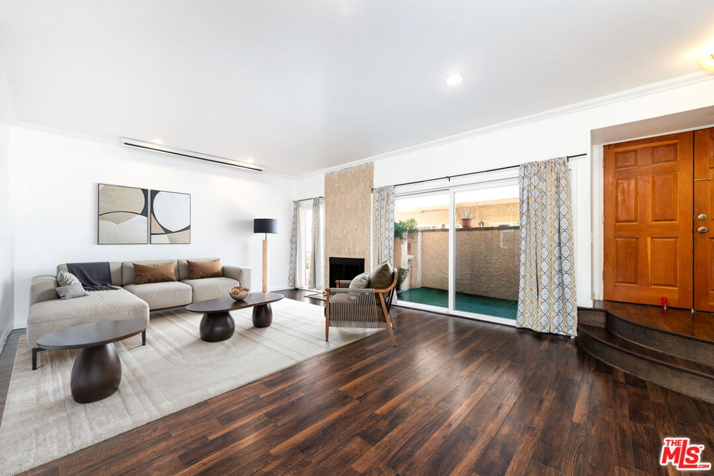 Welcome to this spacious and stylish 3-bedroom, 2.5-bathroom townhouse located in the heart of Encino, one of the San Fernando Valley's most desirable communities. Just north of Ventura Boulevard, you'll have easy access to top-rated restaurants, shopping, and entertainment, while being close to local parks, hiking trails, and a community garden perfect for outdoor enthusiasts and families alike. Step inside to a bright, open-concept living area featuring a gas fireplace, dry bar, and recessed lighting throughout. The generous layout includes a formal dining area, plus a secondary dining nook and breakfast counter adjacent to the updated kitchen ideal for entertaining or casual family meals. Enjoy the comfort of freshly painted interiors, central A/C and heat (Nest operated), a reverse osmosis water system, updated bathrooms, and included appliances: Washer, Dryer, Refrigerator, Oven & Stove. Extra closet space provides plenty of room for storage, and your own garden area just off the front patio offers a peaceful, personal outdoor retreat. This well-maintained community boasts resort-style amenities, including a pool, spa, gym, recreation room, and picnic area. You'll also benefit from two tandem parking spaces and access to some of the top rated schools in the area. Don't miss the opportunity to own this move-in-ready gem in one of Encino's most coveted locations. Comfort, convenience, and California living all come together here.