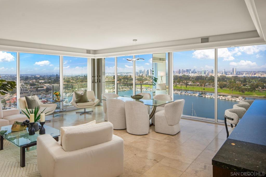 Penthouse with Unrivaled Views!This corner penthouse offers arguably the most spectacular views in all of Coronado. This modern, 2-bedroom residence offers panoramic floor-to-ceiling views that capture Glorietta Bay Marina, golf course, the San Diego Bay & skyline extending to the distant hills, the iconic Hotel Del, and slice of the beach and Pacific Ocean to Point Loma. Enjoy front-row seats to Coronado’s 4th of July fireworks, SEAL training exercises, weekend weddings at the town square, and events at the community center below. It’s not just a view—it’s a living, dynamic canvas of life. This furnished unit has been meticulously maintained and generously outfitted with premium appliances, Black Pearl granite countertops throughout, insulated glass with remote-controlled shades on all windows for comfort and quiet. Unwind on a Tempur-Pedic mattress, sip from cut-crystal glasses at the wine bar … Relax. The Shores is an amenity-rich resort community featuring gated access, 24-hour doorman and security, elevator access to garage parking and storage, and lush landscaped grounds. Dog-friendly and perfectly situated for your lifestyle—surf, picnic on the sand, or stroll to town for shopping and fine dining. Resort amenities include a wellness center, spa, sauna, Jacuzzi, modern fitness equipment, seven tennis courts, pickleball courts, and four oceanfront pools with Jacuzzis and BBQ areas. The Beach Club hosts live music and entertainment on weekends and offers a private venue for owner events. Prefer a west-facing ocean view? Consider the harsh afternoon sun blazing in, only to fade to the black of night. This penthouse offers a better alternative— bright, livable, serenity with spectacle and unmatched in its perspective