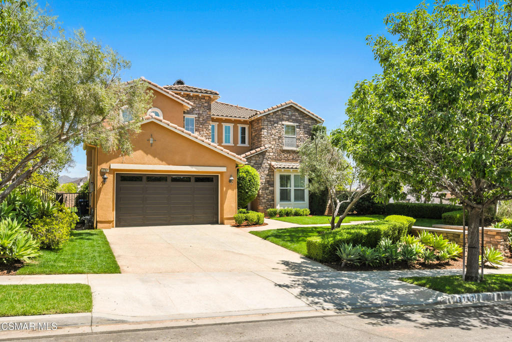 HOME HAS VA ASSUMABLE LOAN AT LESS THAN 3%! Step into this extensively upgraded former model home, offering over 3,200 square feet of thoughtfully designed living space and located on a spacious 10,454 square foot lot in one of Simi Valley's most desirable neighborhoods.As you enter, soaring ceilings, crisp crown molding, and plantation shutters set an elegant tone. Travertine and marble flooring guide you through the main level, where you'll find a formal living space that transitions seamlessly into a refined dining area with inset display shelving and downlighting--perfect for entertaining.The heart of the home is the chef's kitchen, featuring granite countertops, custom cabinetry, a large center island with a sink, and high-end KitchenAid stainless steel appliances, including a 6-burner gas range and a new microwave. There's both a breakfast bar and a cozy nook for casual dining. The kitchen flows into the spacious family room, where recessed lighting, built-in bookcases, a custom entertainment center, surround sound, and a warm fireplace create a welcoming atmosphere.Tucked just off the main living area is a sophisticated home office that can double as a downstairs bedroom, with French glass doors, built-in cabinetry, and a custom wine rack. Nearby, a full bathroom features marble counters and flooring, offering both style and function for guests. Also on the main level, the well-appointed laundry room includes travertine counters, built-in cabinetry, and a sink, combining convenience with elegant finishes.Upstairs, the luxurious primary suite offers double door entry, sweeping views, and a tranquil retreat complete with custom draperies, plantation shutters, and an electric fireplace. The primary bath includes a stall shower, oversized garden tub, and an expansive double-sided walk-in closet with natural light. Three additional bedrooms complete the upper level, each designed with comfort, style, and generous closet space.This home also boasts exceptional accessory features designed for comfort and efficiency. A fully owned 12,210-watt solar system significantly reduces energy costs. Dual-zone A/C units were replaced in 2021 for optimal climate control. The beautifully manicured front and rear yards feature fresh sod and brand-new drip and sprinkler lines, and the oversized two-car garage is fully finished for additional functionality.With timeless finishes, thoughtful upgrades, and energy-saving amenities throughout, this residence offers the perfect blend of elegance, practicality, and California living.