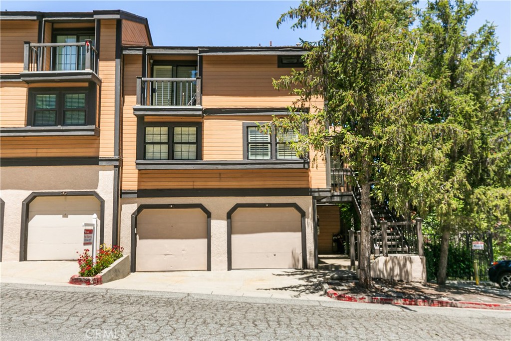 Lakefront Level-Entry Condo in Coveted Lake Arrowhead Village-Turn Key and Rental Ready.
This elegant lakefront condo offers panoramic lake views from every room-a rare gem in the Lake Arrowhead market. Situated just steps from a private dock that is included. The spacious living room features oversized windows, flooding the space with natural light. The floor to ceiling fireplace keeps it warm on those cold winter nights. The gormet kitchen has top-of-the-line appliances and granite countertops and ample storage. There are two primary bedrooms with adjoining baths. A large family room could be a third bedroom. An attached garage allows direct access into the unit. Offered turnkey with furnishings included making it a hassle-free primary or fully equipped rental. Located in the historic Lake Arrowhead Village, this condo offers access to boutique shops, waterfront dining, and open-air concerts. The Village is a social hub for locals and visitors alike. This property has a strong vacation-rental tract record achieving top-tier performance. Perfect for buyers seeking the lake lifestyle, strong rental income, and access to every amenity Lake Arrowhead offers.