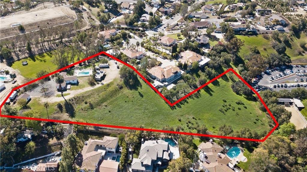 Incredible Development Opportunity on 3.17 Acres in a Prime Yorba Linda Location. This property offers unmatched views rarely found in West Yorba Linda. A unique chance to own two contiguous parcels totaling over 3 acres in the heart of the city. Tucked away on a quiet stretch of Highland Avenue, this unique offering includes a 2.5-acre parcel and an adjacent 0.67-acre lot. both offering endless potential for redevelopment, equestrian use, or a custom family compound.The property currently includes an older ranch-style home and detached structures, ideal for renovation or replacement. With gentle terrain, mature trees, and access to the Yorba Linda horse trail system, this is one of the few remaining multi-acre properties in the area zoned for horses and rural residential use. Whether you envision building a dream estate, creating an equestrian retreat, or exploring future development opportunities (buyer to verify with the city), this property offers a truly exceptional canvas. Utilities on site. No HOA. Minutes from top-rated schools, shopping, and freeway access. Don’t miss this once-in-a-generation land opportunity in one of Orange County’s most sought-after communities. Minimum lot size requirement is 24,200 square feet per dwelling unit.