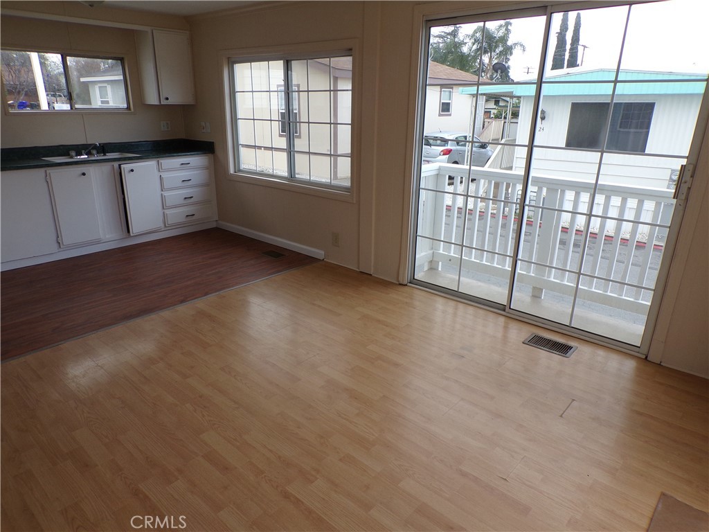 This welcoming 2-bedroom, 1-bathroom manufactured home offers comfortable living with a bright, open-concept floorplan connecting the living room and kitchen. Enjoy the convenience of a dedicated laundry room with washer and dryer hookups. Additional features include a carport for off-street parking, with extra parking available upon request. One cat or dog allowed, not to exceed 20 pounds full-grown. Equal Housing Opportunity. Real Estate Advisors Inc DRE: 01476651