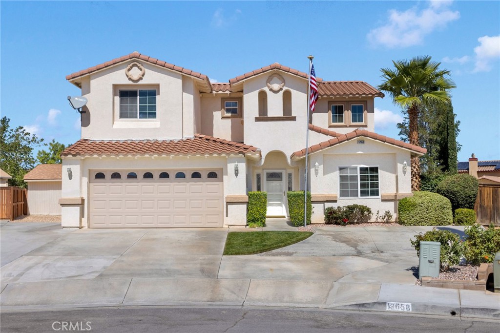 Welcome to prestigious Eagle Ranch—where timeless Spanish style meets resort-style living. This spacious 2,799 sq. ft. home sits proudly on a 12,500 sq. ft. cul-de-sac lot and has been lovingly maintained by its original owners since 2003.
Step inside to soaring high ceilings, a grand stairwell, and an open layout filled with natural light. The master suite on the main floor is a private retreat with garden-style French doors opening directly to the backyard oasis. The luxurious master bathroom features a soaking tub, dual sinks with additional vanity, a walk-in shower, a private water closet, and a huge walk-in closet. A second downstairs bedroom offers flexibility for guests, in-laws, or a home office. Upstairs, you’ll find two additional bedrooms plus a spacious loft that opens to a private outdoor balcony.
The true showpiece of this home is the resort-inspired backyard—complete with an in-ground pool, diving board, slide, lush green grass, apple trees, and a large storage shed. Whether you’re hosting family BBQs, relaxing in the sun, or enjoying quiet evenings, you’ll feel like you’re on vacation year-round. Pride of ownership shines throughout, from the American flag proudly displayed on the flagpole to the meticulous care that makes this home move-in ready. Nestled at the end of a peaceful cul-de-sac in one of Victorville’s most sought-after neighborhoods, this is truly the best home available in Eagle Ranch.
Don’t miss your chance to make this dream home your reality. Opportunities like this are rare—schedule your private showing today before it’s gone!