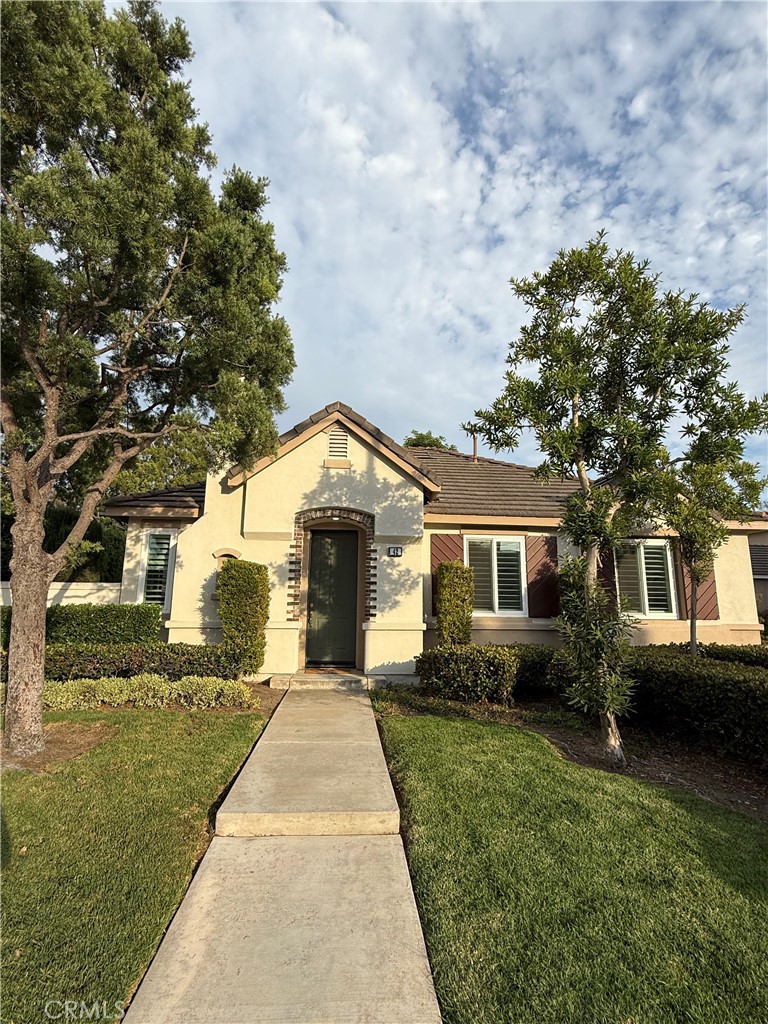Welcome to this single-level townhome in the highly desirable gated Sea Country community of Rancho Santa Margarita. Offering 3 bedrooms, 2 baths, and approximately 1,200 sq ft, this home lives like a detached residence with no one above or below. The open layout features a bright living room with fireplace, dining area, and a remodeled kitchen with bar seating, quartz counters, abundant cabinetry, and stainless appliances. The primary suite includes a walk-in closet, soaking tub, separate shower, and private water closet. A spacious secondary bedroom, flexible den/third bedroom, in-unit laundry, and a direct-access two-car garage with Tesla charger, epoxy flooring, built-ins, wall storage, and finished attic space add convenience. Laundry washer/dryer machines; along with a mounted flat screen TV in the family room are included.