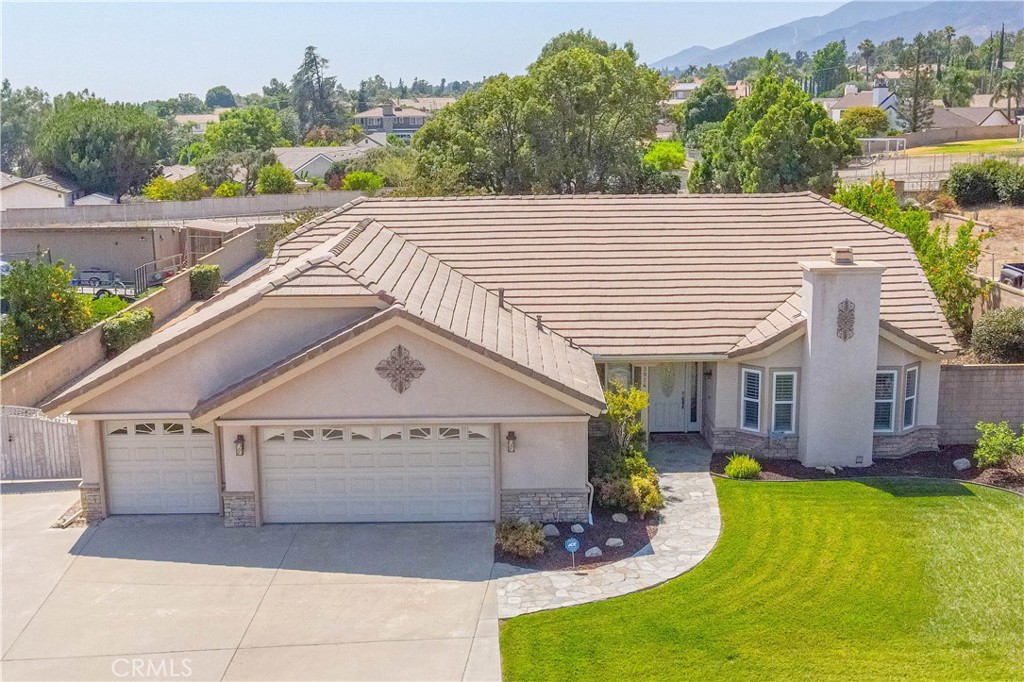 Rare Single Story Jewel nestled high along the foothills of prestigious Alta Loma! Completely remodeled & thoroughly upgraded, this spectacular home rests on a prime half acre. This lot is large enough to build an ADU or accommodate horses! You will notice meticulous attention to detail from the front, including the slate walkway & porch leading to the beautiful custom front doors & entryway. Soaring ceilings & neutral décor greet you into the Foyer. The spacious Formal Living Room features a brick inlay fireplace & offers ample space for entertaining. The Formal Dining Room is also very spacious, boasting plenty of room for your largest family holiday feasts. Newer dual paned windows & plantation style shutters accentuate the extreme bright & open floor plan. The chef’s Kitchen is beautifully adorned with gleaming stainless steel appliances, dark cherry wood soft close cabinetry & polished quartz countertops. Enjoy the large Family Dining Area with pristine views of the spectacular backyard. Generous sized Family Room is perfect for an oversized TV & extensive entertainment center. It can easily accommodate gatherings of any size, & offers direct access to the sprawling backyard & covered patio area - great entertainment possibilities! The hall bathroom has been fully remodeled & arrayed in tasteful neutral décor. All bedrooms are upgraded with custom window dressings, paint, baseboards, ceiling fans & closet organizers. Exquisite Primary Suite! Completely remodeled with a deluxe permitted addition that features a huge walk-in closet equipped with custom built-in organizers. Breathtaking ensuite bathing quarters feature a floor warmer, large soaking tub & separate beautifully inlaid open shower with 2 showerheads (1 rainfall)& 4 niches. Smartly designed with a private commode, elegant lighting fixtures & views of the backyard’s majesty (a Must See!). View Cucamonga Peak from the professionally landscaped backyard (low water use). Meticulously groomed & manicured with the privacy you crave. The petite waterfall/pond, gas fire pit & block walls add to the relaxation & tranquility. The custom solid patio cover along with extensive decking & hardscaping make this backyard oasis an entertainer's delight. The finished 3 car garage & massive RV parking put this property in perfect balance. Award Winning Schools (walking distance), world class shopping/dining, parks & recreation options, and friendly neighbors make this the perfect place to call Home Sweet Home!