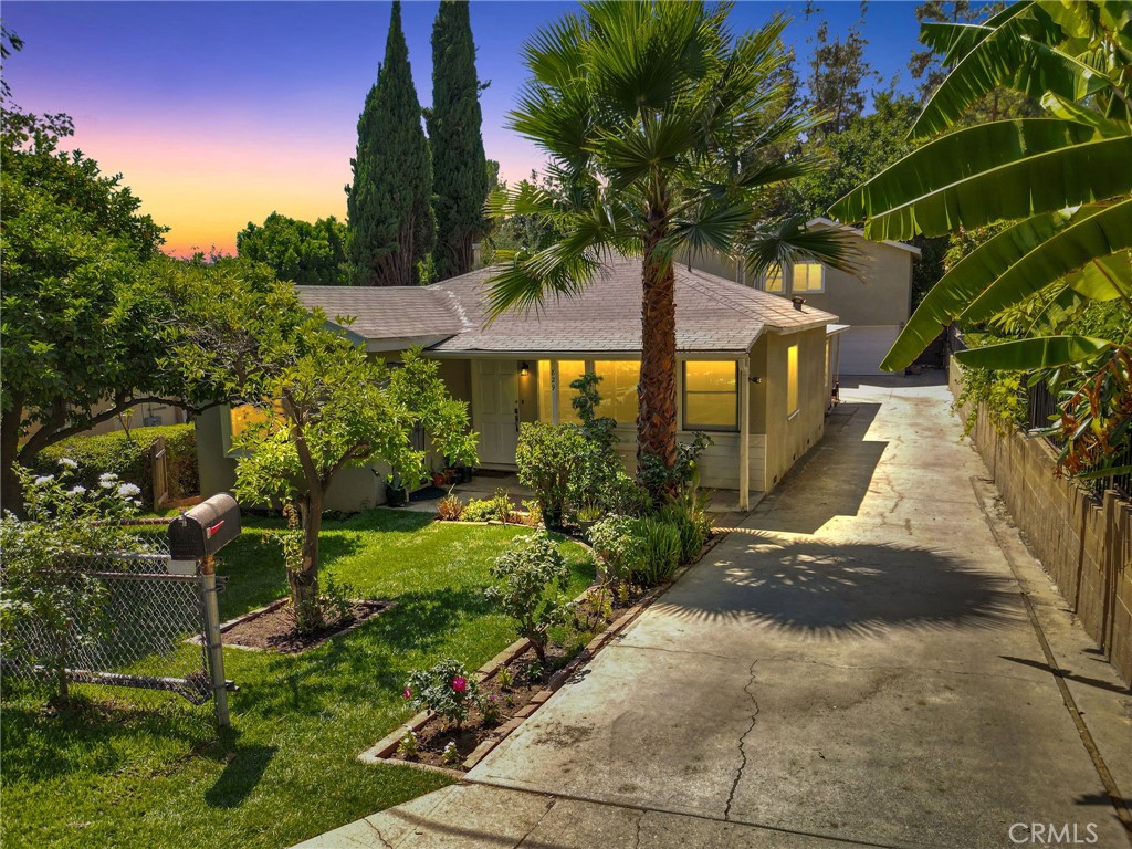 Tucked away on a quiet cul-de-sac in the highly desirable Garvanza/Arroyo Estates, this charming 1950’s Traditional 6 Bedroom home offers a flexible floor plan. Step inside to a bright front room with hardwood flooring and abundant windows that can serve as a living room or formal dining space. The expanded first bathroom features a full-size walk-in shower and plenty of closet/storage space. The good size kitchen with a bar that seats two, perfectly separating the kitchen from the dining area for a defined layout. The front bedroom includes a charming garden window overlooking the yard and a private exterior entrance, while a second bedroom offers ample storage and direct outdoor access. A few steps down, you’ll find the large living room with sliding glass doors leading outside and a stunning mid-century modern freestanding fireplace. Just off the living room, an additional space that can be used as a home office, gym, or den, complete with sliding glass doors for privacy and its own outdoor entrance. Two additional bedrooms downstairs each feature private exterior entrances, providing excellent options for guests or extended family. The full-size laundry closet and a second large full bath with a tub/shower combo and outdoor access complete the lower level. Upstairs, the primary suite boasts a spacious bathroom with dual sinks, a jacuzzi tub, and a separate walk-in shower. The walk-in closet includes dual entrances (bedroom and bathroom) and custom built-in shelving. The primary bedroom offers two balconies one overlooking the backyard and another connecting to the fifth bedroom. Additional highlights include individual thermostat controls for each bedroom, recessed lighting throughout, a two-car garage with direct home access, ample parking on the property, and fruit trees with a lemon tree in the front yard and a mango tree in the backyard. This property’s unique layout, charm, and location make it a rare find in one of the area’s most sought-after neighborhoods. All this just minutes from Pasadena, Highland Park, Eagle Rock, DTLA, and easy access to the 110 Freeway.