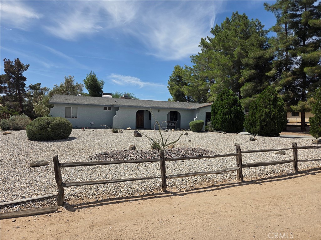 APPLE VALLEY - NEAR APPLE VALLEY GOLF COURSE - First time on the market. Prime location. As you step inside, you'll find a spacious 1,654 SF floor plan. The home features two large bedrooms and two full baths, along with a formal living room, dining room, and family room with fireplace that opens to the kitchen and has access to back yard. A standout feature is the versatile bonus room with a wet bar, offering endless possibilities. Easily convert it into a third bedroom, a home office, or a game room, whatever suits your lifestyle. There's a covered patio and mature landscaping. With the Apple Valley Golf Course. shopping and restaurants just minutes away, this home has charm and convenience.