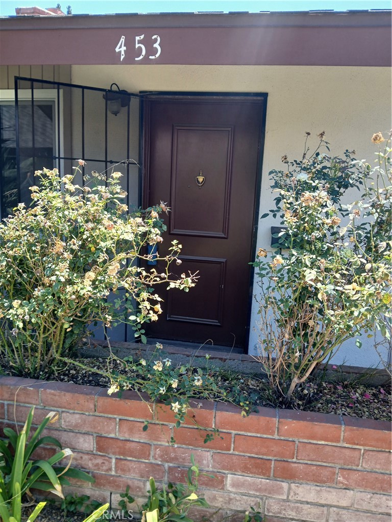 Rarely available charming Palmwood condo in the heart of Old Tustin. All ages are welcome. Two bedroom, two bath with a wood-burning fireplace. One car detached garage plus one parking space. New dual pane windows and slider, new stainless steel Samsung dishwasher. New kitchen cabinets and new carpeting throughout. New vanities and toilets in both bathrooms, new tub. New bathroom faucets and countertops; one is quartz. Private patio. Easy access to Routes 5 and 55. Information is deemed reliable, but buyers and their agents are required to perform their own due diligence with regard to all aspects of the property.