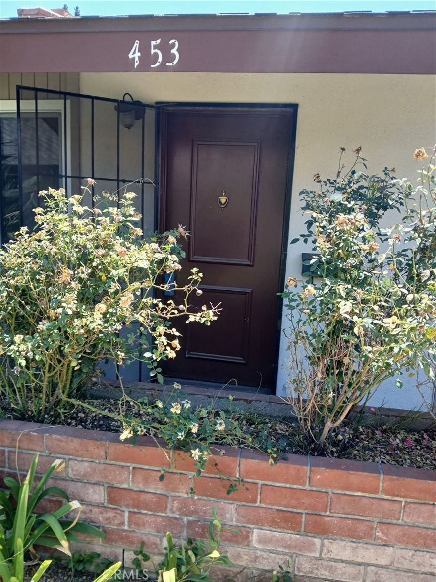 Drastic price reduction! Owner wants it sold.  Rarely available charming Palmwood condo in the heart of Old Tustin.  All ages are welcome.  Two bedroom, two bath with a wood-burning fireplace.  One car detached garage plus one parking space.  New dual pane windows and slider, new stainless steel Samsung dishwasher. New carpeting and laminate flooring throughout. New vanities and toilets in both bathrooms, new tub and new shower. New bathroom faucets and countertops; one is quartz.  The entire unit has been re-painted, and all light switches and switch plates replaced.  Very private patio.  HOA dues include water, trash and exterior maintenance.  Easy access to Routes 5 and 55.  Information is deemed reliable, but buyers and their agents are required to perform their own due diligence with regard to all aspects of the property.