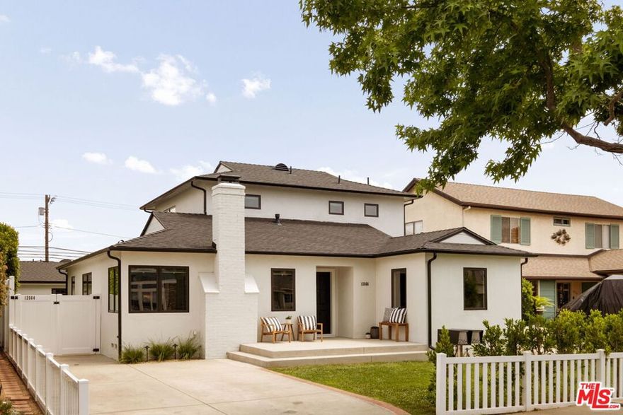 A rare offering in Mar Vista's hottest neighborhood. This thoughtfully upgraded compound pairs timeless style with modern function across a spacious main residence and a private guest house ADU. All of this situated on an oversized lot with dual street access allowing for tons of flexibility. The 3 bedroom/3 bathroom main house spans two beautifully appointed levels just over 2,000 square feet. Some recent major upgrades include new roof, new custom windows, fully remodeled bathrooms (2024) finished in Carrara marble, frameless glass shower doors, fresh interior paint. Crown molding, dark-stained oak hardwood floors, and a wood-burning fireplace bring warmth and character, while a sunlit family room opens directly to the lush backyard. The chef's kitchen features bright Carrara marble countertops and a clean, efficient layout. All utilities are underground, including internet, cable, and telecom wiring. The 1 bedroom/1 bathroom guest house ADU, built in 2020 by Sowa Development, offers 647 square feet of modern, self-contained living with its own private entrance, separate utilities, and a fully wired infrastructure for internet, security, and smart features. Inside, you'll find vaulted ceilings, central HVAC, a tankless water heater, and a custom chef's kitchen with quartz countertops, a 6-foot island, built-in laundry closet, and custom cabinetry. The oversized bedroom includes a walk-in closet and a spa-style bath. Outdoors, enjoy a private, protected patio exclusive to the guest house, perfect for guests, tenants, or a work-from-house set up. Additionally, accordion tri-fold doors create seamless indoor-outdoor flow to the main yard, perfect for entertaining or family fun. Outdoor amenities are equally impressive, with extensive top cast/sand-finished patios, porches, walkways, and driveway creating seamless flow and an elevated aesthetic throughout the property. The expansive yard features manicured landscaping, mature fruit trees, 20-foot privacy hedges, grassy lawns, and full-perimeter white vinyl fencing. A custom Vista lighting system adds a warm glow in the evenings, perfect for outdoor gatherings in a parklike setting. This property is more than a home it's a versatile compound that balances elegance, comfort, and opportunity. Come explore one of Mar Vista's most sought-after pocket neighborhoods, offering easy access to some of the Westside's favorite restaurants and shops - Beethoven Market, Bluey's, Alana's Coffee, and so much more. In addition, this location offers easy access to LA's best beaches and parks. This is an opportunity not to be missed!
