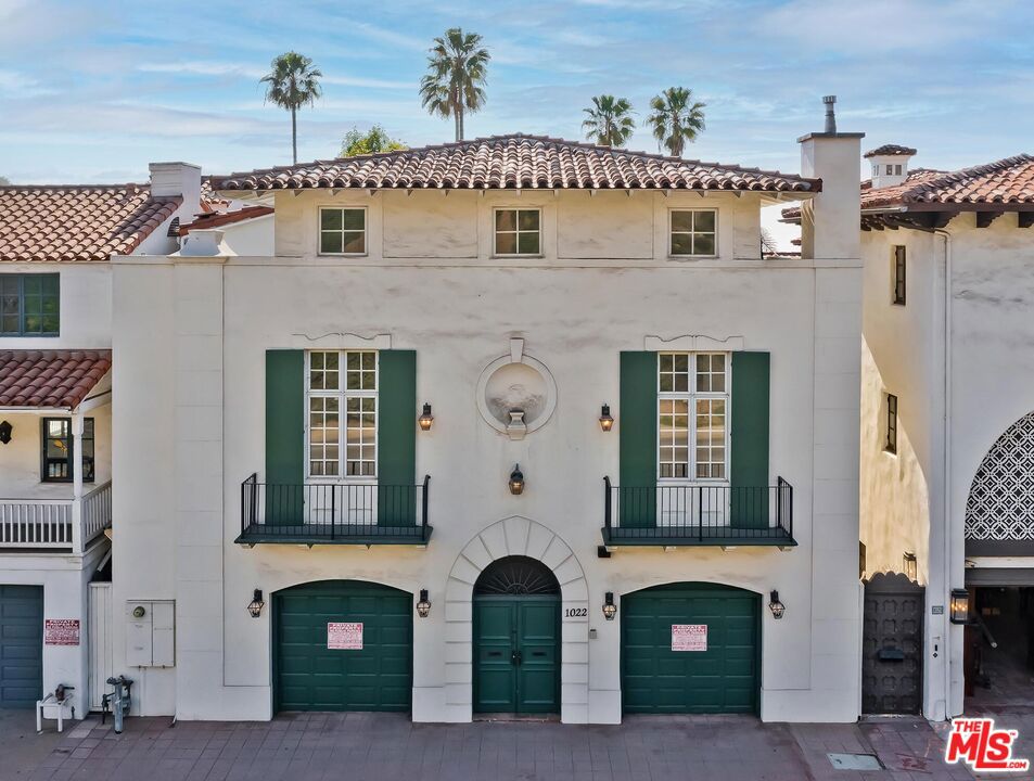 This pristine Mediterranean-style Villa, ideally situated on Santa Monica's infamous Gold Coast with incredible ocean views, will surely take your breath away.From the moment you enter through the private courtyard, you will be welcomed inside to the open and spacious step-down living room adorned with high beamed ceilings, hardwood flooring, and a stately fireplace which further enhances the home's warm and inviting ambiance. Expansive pocket-style sliders open seamlessly to the resort-style outdoor living space showcasing a newly redone dark-bottom and glass tile pool, water feature, spa and fireplace, all set in a private, romantic garden offering direct access to the beach. The main level also includes a grand formal dining room, large gourmet kitchen with top-of-the-line appliances, breakfast area with banquet seating and an expansive center island with plenty of room for counter stools. Adjacent to the kitchen is a laundry room and half- bath. A staircase with beautiful wrought iron detail leads down to a second half-bath and inviting recreation room which includes a pool table, temperature-controlled win cellar, wet bar, bathroom, and a stairwell leading up to the pool area. The second floor of this beachfront gem boasts an enormous master bedroom suite with head-on ocean and coastline vistas, fireplace, spa tub and dual bathrooms each with there own walk-in closet and dressing area. Also located on this level are two ensuite bedrooms and generously-sized bonus room which is ideal for a gym, playroom, art studio, etc. A separate staircase provides convenient access to the kitchen. The main staircase takes you to the third floor which offers three additional ensuite bedrooms, one of which looks out to the ocean. There is also a sitting room/den and an expansive deck with built-in seating perfect for enjoying the spectacular views and picturesque sunsets. Situated on the top floor, perfect for in-laws and overnight guests, is a self-contained living area featuring a bedroom and bath, living room, kitchenette, and step-out deck. Other amenities include beautifully renovated bathrooms, hardwood floors, an updated Smart TV system, multi-zone AC and heating, updated wired and wireless networks, a new multi-zone streaming audio system, security system, ample storage and a two-car attached garage.