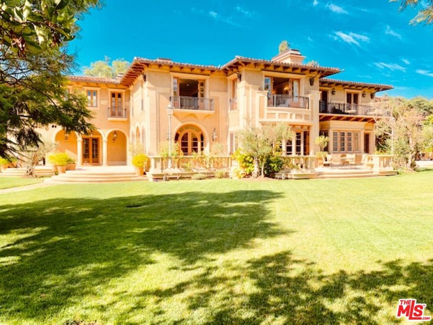 Located behind gates on one of Beverly Hills most desirable streets, North of Sunset, a legendary estate featuring a palatial Mediterranean masterpiece. Offering resort-style living throughout its spectacular 1.3 all level and flat acres. Built with incredible craftsmanship and quality with a European sensibility designed by renowned architect Kevin Clark, every inch of this Italian villa-inspired home is composed of only the finest materials. Inlaid marble and walnut floors, silk carpets, antique wood-burning fireplaces, beautiful millwork crown moulding, cornices and wall paneling, and coffered ceilings can be found throughout the home's grand 15,328 square feet. World class amenities include a home theatre, 1000 bottle wine cellar and tasting room, gym, sauna, two-bedroom guest house, pool, and formal gardens dotting the sprawling park-like grounds. An incredibly rare opportunity to acquire one of Beverly Hills finest estates. Shown to pre-qualified clients only.