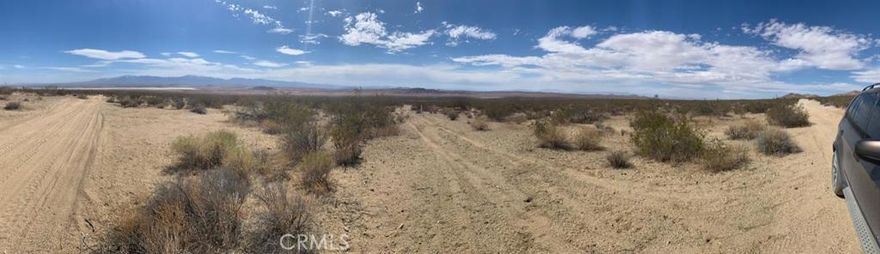 Owner is willing to carry the financing for this wonderful 5 Acre parcel with terrific down valley views and awesome views of the El Mirage Dry Lake Bed. Sitting up high above the valley this parcel provides great privacy yet has good accessibility.  Perfect for your weekend getaway, camping, recreation, etc.  Buyer to conduct their own due diligence with regard to land use, zoning, etc.