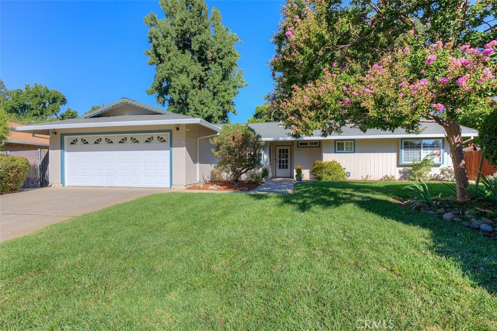 Nestled on a beautiful, tree-lined street, this delightful 3-bedroom, 2-bath home sits on a generous quarter-acre lot and is filled with warmth, character, and comfort. Set in a quiet, well-established neighborhood and embraced by mature landscaping, this one-owner gem has been meticulously cared for over the past 40+ years, making it a rare and special find. The inviting kitchen showcases rich oak cabinetry, tile countertops, black appliances, a removable island, and a large pantry. Thoughtful built-ins, an eat-in nook with space for a full dining table, and an abundance of natural light make this space both functional and warm. In the living area, engineered bamboo hardwood flooring pairs beautifully with a custom-built slate gas fireplace—the true centerpiece of the room. Accented by skylights, crown molding, recessed lighting, and fresh paint throughout, the home exudes elegance and timeless charm. You'll find two generously sized bedrooms and a spacious hall bathroom with a tub-shower combo. The primary suite is a relaxing retreat, featuring a large walk-in closet and a thoughtfully designed ensuite bathroom with a steam shower and dedicated vanity area.
The home’s curb appeal shines with meticulously maintained landscaping, while the expansive backyard offers endless possibilities—a blank canvas ready for your vision. Whether you dream of adding a pool, ADU, outdoor kitchen, or creating a peaceful garden retreat, the space is yours to shape. Lovingly cared for from top to bottom, this home is ready for its next chapter. Bring your dreams and create lasting memories in a place you’ll be proud to call home.