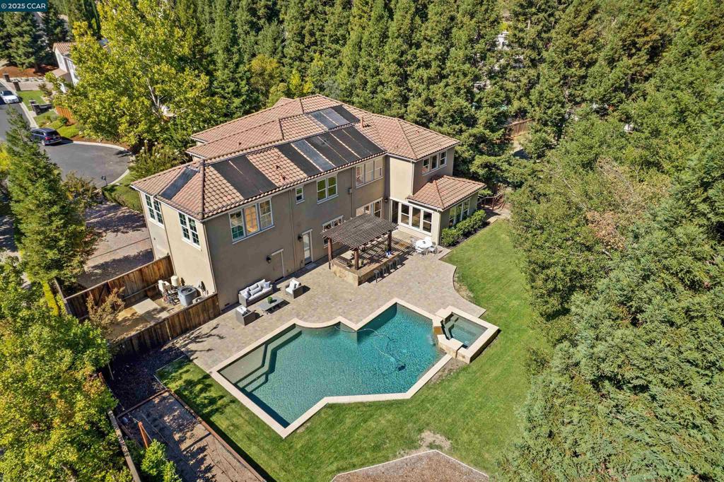Stunning 6BD/5.5BA Lennar-built home in Alamo’s Barrington Woods offers 5,244± sq. ft. on a private .52-acre cul-de-sac lot. Freshly updated with new paint, carpet, and lighting. Chef’s kitchen features a 48” 7-burner double oven, Wolf microwave, Sub-Zero refrigerator, two KitchenAid dishwashers, and Zephyr wine fridge. Flexible floorplan with multiple living areas, large bonus room, and main-level ensuite bedroom with backyard access. Resort-style yard with pool/spa, built-in Bull BBQ, lawn, and patio areas. Spacious primary suite with walk-in closet, soaking tub, and shower. Three-car garage, raised garden beds, and storage shed. Close to Alamo Plaza, Round Hill CC, Mt. Diablo trails, top-rated schools, and easy 680 access.