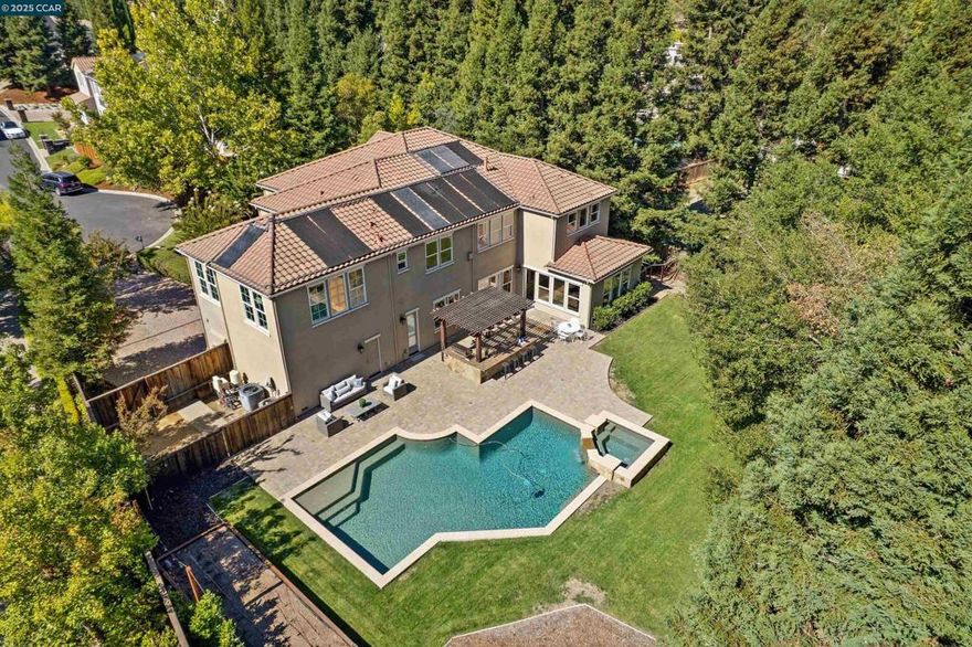 Stunning 6BD/5.5BA Lennar-built home in Alamo’s Barrington Woods offers 5,244± sq. ft. on a private .52-acre cul-de-sac lot. Freshly updated with new paint, carpet, and lighting. Chef’s kitchen features a 48” 7-burner double oven, Wolf microwave, Sub-Zero refrigerator, two KitchenAid dishwashers, and Zephyr wine fridge. Flexible floorplan with multiple living areas, large bonus room, and main-level ensuite bedroom with backyard access. Resort-style yard with pool/spa, built-in Bull BBQ, lawn, and patio areas. Spacious primary suite with walk-in closet, soaking tub, and shower. Three-car garage, raised garden beds, and storage shed. Close to Alamo Plaza, Round Hill CC, Mt. Diablo trails, top-rated schools, and easy 680 access.