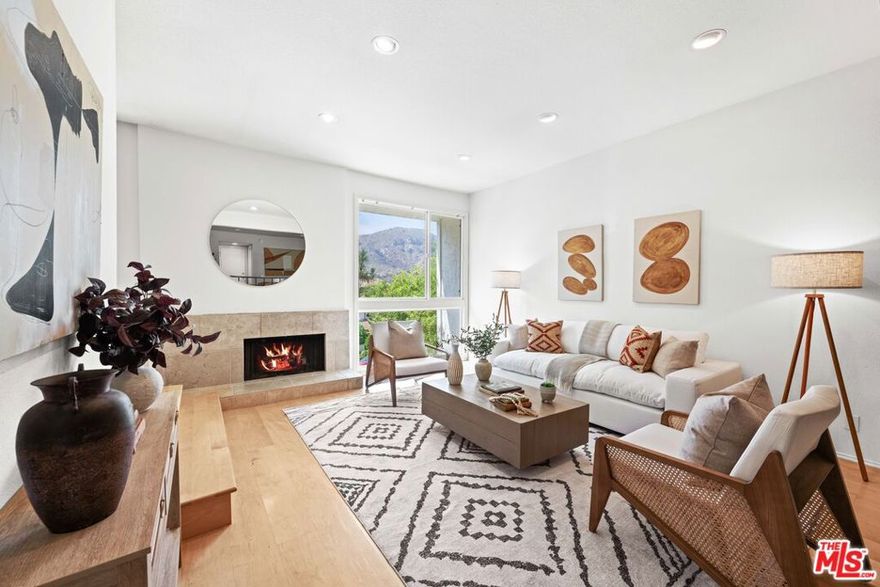 Mountain View Townhome with Thoughtful Updates! Welcome to this beautifully updated 3-bedroom, 2.5-bath townhome nestled in the heart of Pacific Palisades. With nearly 2,000 sq ft of living space, this residence combines comfort, function, and a true sense of retreat. The main level offers an open living and dining area filled with natural light, seamlessly connected to a remodeled kitchen featuring bamboo cabinetry, granite countertops, stainless steel appliances, and a convenient breakfast nook with treetop and mountain views. It's a space designed for both everyday living and relaxed entertaining. Upstairs, the primary suite is a restful haven with vaulted ceilings, a private balcony showcasing mountain and treetop vistas, generous closets, and a spa-inspired bath with soaking tub. Downstairs, two additional bedrooms include one oversized room with bonus space and direct access to a spacious flagstone patio perfect for lounging, gardening, or enjoying peaceful hillside views. Additional highlights include recessed lighting, a water filtration system, and side-by-side laundry in the attached two-car garage with direct access to the main level. Enjoy resort-style amenities including a sparkling pool, spa, sauna, fitness center, and tennis courts, all set within beautifully landscaped grounds. Located just minutes from schools, hiking trails, beaches, and Palisades Village, this home perfectly blends modern comfort with natural beauty. Experience Palisades Highlands living with mountain and treetop views - schedule your private tour today.