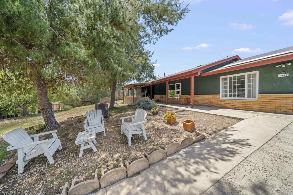 Discover this charming country retreat nestled on nearly 3 acres of usable land in beautiful Fallbrook! This 4-bedroom, 3-bath home offers the perfect blend of modern upgrades and rustic charm. Surrounded by mature citrus trees, the property offers a peaceful, natural setting. A private well is available for irrigation, making garden maintenance easy and efficient. Inside, you'll find fresh paint throughout and brand-new appliances, combining comfort with modern convenience. Don't miss this rare opportunity to enjoy country living with updated amenities. Features Include: Fresh interior paint & new flooring throughout, Cozy wood-burning fireplace, Remodeled kitchen with wood countertops, gas range/oven & dishwasher, Recently updated pool with new pump, timer & filter, Central heating, 2-car garage, new water heater, Tesla solar lease, Dual water sources: city water for home + well water for irrigation, Double-pane windows & exterior painted just 2 years ago, Fruit trees including pomegranate, Chicken coop—chickens included if desired! Enjoy country living with the convenience of modern updates—perfect for gardening, entertaining, or just relaxing poolside. Contact us today to schedule your private tour!
