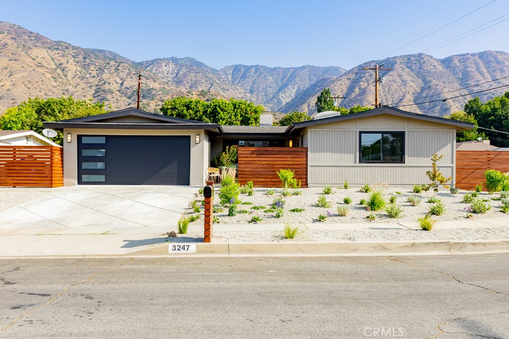 This stunning 4-bedroom, 2-bath residence has been completely remodeled and is move-in ready. Ideally located in a desirable Duarte neighborhood, the home offers both style and functionality with thoughtful upgrades throughout. Step inside to a welcoming formal living room featuring a cozy fireplace and custom built-in bookshelves. The gourmet kitchen has been fully renovated with sleek new cabinetry, quartz countertops, and premium Bosch appliances including refrigerator, cooktop, oven, and microwave. The primary bedroom includes a large closet and ¾ bathroom. Upgrades continue with all-new energy-efficient windows, fresh new flooring, recessed lighting, and modernized electrical and plumbing systems. The interior and exterior have been freshly painted, and the garage features a new door, epoxy flooring, and washer/dryer hookups. Outdoors, enjoy a spacious backyard with a large patio and grassy area which is perfect for entertaining or with plenty of room to add a pool or ADU. The front yard has been freshly landscaped with new irrigation and watering systems for easy maintenance. Every detail has been carefully considered, making this a true turnkey home ready for its new owners.