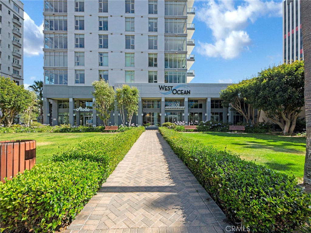 Welcome to West Ocean Towers, a prestigious address offering a harmonious blend of sophistication, security, and convenience. With on-site management and a 24-hour concierge, every detail of this residence is designed to provide peace of mind and a truly elevated urban lifestyle. This spacious two-bedroom, two-bath home is bathed in natural light from oversized windows in every room. Step onto your private balcony to savor refreshing ocean breezes and breathtaking sunsets. Inside, beautiful hardwood floors create a warm, inviting foundation, while the open-concept kitchen features stainless steel appliances, rich wood cabinetry, and granite countertops—perfect for both casual meals and elegant entertaining. Additional comforts include central air and heat, an in-unit stackable washer and dryer, two separate parking spaces (not tandem, one is oversized), and tasteful designer finishes throughout. Residents of West Ocean Towers enjoy an exceptional suite of amenities, including multiple fitness facilities and business centers, multipurpose club room with a full kitchen and climate-controlled wine storage locker, a banquet room, pool, spa, sauna, multiple barbecue areas, with various lounging options, and an outdoor fireplace. There is designated a deeded storage space along with a bike room for storing along with air and tools available. A guest suite is also on premises for a rental fee for the residents’ guests to use. All curated for refined coastal living in this bike-friendly city. The building is located close to all of that Long Beach has to offer; performing arts center, convention center, arts district, downtown, Shoreline Village/Pier, Aquarium of the Pacific, and the Queen Mary.