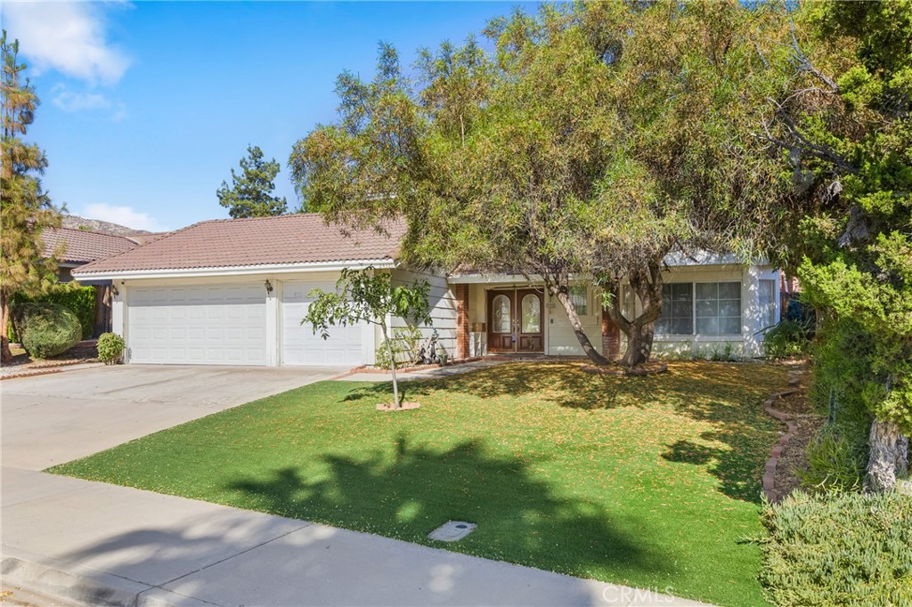 Welcome to Sunnymead Ranch! This spacious 4-bedroom, 2.5-bathroom home with a versatile bonus room is located just minutes from Sugar Hill Elementary School. Offering great curb appeal with mature trees, a large driveway, and a 3-car garage, this home is perfect for those who need extra parking and love a warm, welcoming exterior. Inside, you’ll be greeted by soaring ceilings and a grand staircase, setting a dramatic tone. To the right, the living room features a cozy fireplace and a large window that fills the space with natural light. The kitchen has been beautifully updated with newer cabinets and countertops, and charming plantation shutters that extend into the adjoining family room—ideal for relaxing, entertaining, or converting into a formal dining space. Throughout the home, you’ll find recessed lighting, ceiling fans, and plenty of windows that allow for abundant natural light. In addition, this property comes with a paid-off solar system, allowing you to enjoy energy savings and avoid high electric bills. Downstairs also includes a bonus room that can serve as a home office, gym, or potential fifth bedroom, along with a convenient laundry room and half bathroom. Upstairs, you’ll find four generously sized bedrooms. The primary suite is a true retreat, offering enough space for all your favorite furniture, a private balcony perfect for enjoying your morning coffee, and an en-suite bathroom with dual sinks, a walk-in shower, and an oversized closet. The three additional upstairs bedrooms are spacious and versatile, perfect for family members or guests. Step outside to a backyard that features a lattice patio cover and plenty of space to create your dream outdoor oasis. This home is part of the highly desirable Sunnymead Ranch Homeowners Association, which offers an impressive array of amenities including a private gated clubhouse, swimming pool, spa, sports courts, pickleball court, playgrounds, BBQ areas, picnic spaces, and even a lake where you can go fishing. With its prime location near top-rated schools, shopping, and easy highway access—and the added bonus of a paid-off solar system—this home offers both comfort and value in a beautiful community setting.