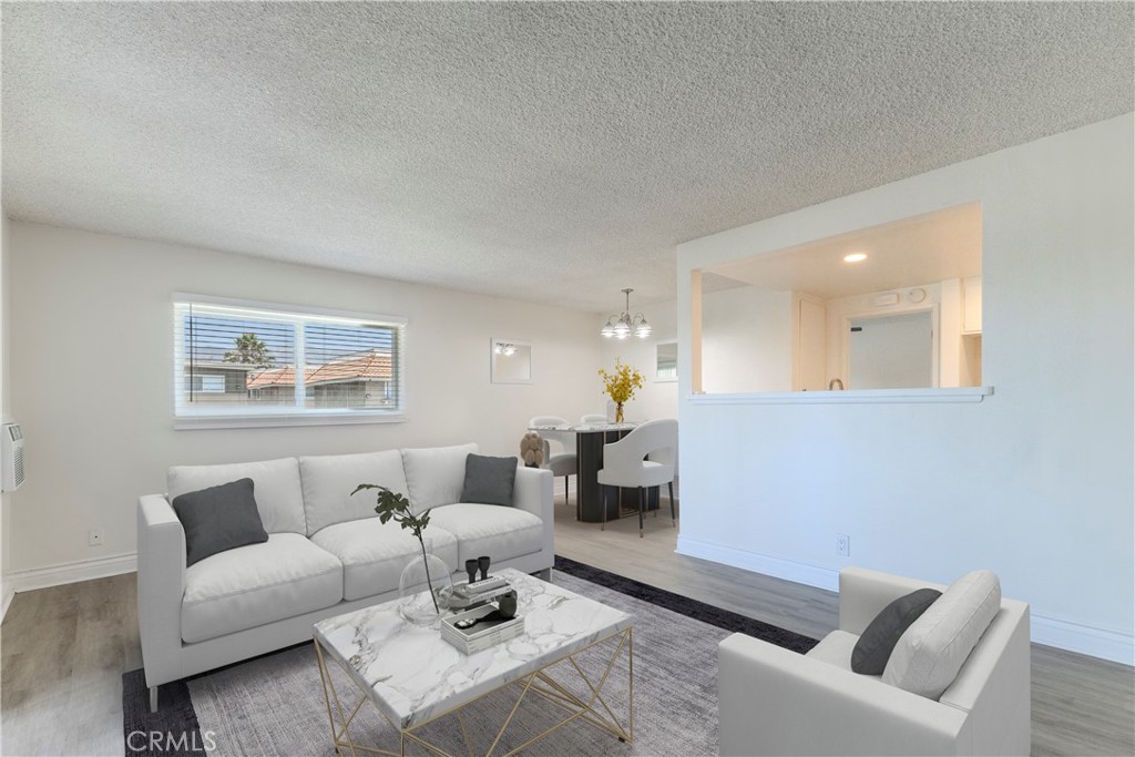 Discover modern living in this fully renovated upper-level condo, ideally located near the heart of Downtown Pomona. This 1-bedroom, 1-bathroom home offers 565 square feet of thoughtfully updated space in a gated, two-story complex. Step inside to find brand-new vinyl flooring, fresh interior paint, and new dual-pane windows that enhance natural light throughout. The updated kitchen features sleek stainless steel appliances, a new sink, and stylish countertops, perfect for everyday cooking or entertaining. The bathroom has been tastefully remodeled, and the bedroom includes mirrored closet doors, ceiling fan, and plantation shutters for comfort and privacy. Enjoy a small private balcony at the front of the unit. This unit includes one covered carport parking space. Located near the 60 and 10 freeways with easy access to surrounding cities.