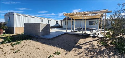 Photo of 6042 Milne Road, Landers, CA 92285 (MLS # PW26009677)