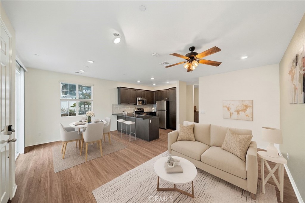 This beautifully upgraded 3 bed, 2.5 bath end-unit condo with a 2-car attached garage combines comfort, style, and smart living. Enjoy upgraded flooring throughout, a chic marble backsplash, and an open, light-filled layout perfect for entertaining or relaxing. Modern smart-home features include keyless entry, a smart thermostat, and smart garage access—plus a whole-house fan for year-round comfort. Located in a well-maintained community with a sparkling pool and just minutes from downtown Murrieta’s shops, dining, and entertainment, this home offers the perfect blend of convenience, efficiency, and modern design.