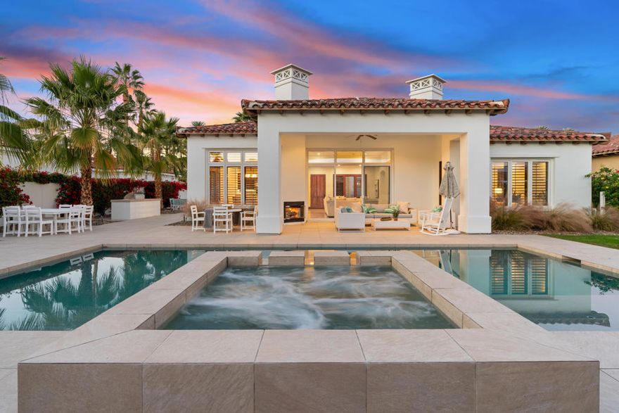 Stunning south-facing residence with 3 bedrooms, plus a den, set within the coveted Palms Golf Club, where timeless desert living meets mountain panoramas. Thoughtfully designed and meticulously maintained, this custom home captures the essence of resort living with a sparkling pool and spa, expansive decking, and a built-in BBQ perfect for gathering with friends and family. A courtyard entry welcomes guests with warmth and privacy, offering direct access to a detached casita. Through double doors, the interiors unfold with impressive scale, featuring vaulted ceilings, travertine flooring throughout, custom shutters, and an open-concept layout that balances refined comfort with an easy indoor-outdoor flow. The great room, anchored by a fireplace and framed by picture windows, connects seamlessly to the dining area and gourmet kitchen, where stainless steel appliances, a beverage cooler, upgraded cabinetry, and a generous breakfast bar create a space that is both functional and inviting, perfect for everyday living or entertaining with ease. The primary suite is a serene sanctuary, with spa-inspired bath features, including dual vanities, a soaking tub, and walk-in shower, enhancing the home's retreat-like atmosphere. The Palms Golf Course, designed by Master's Champion Fred Couples and located within the community, is a place where golf's traditions are cherished, and the lifestyle is lived daily. In addition to world-class golf, this home is ideally positioned within minutes of premier dining, boutique shopping, renowned tennis and pickleball venues, and the Coachella Valley's celebrated festivals, offering effortless access to the very best of desert living.