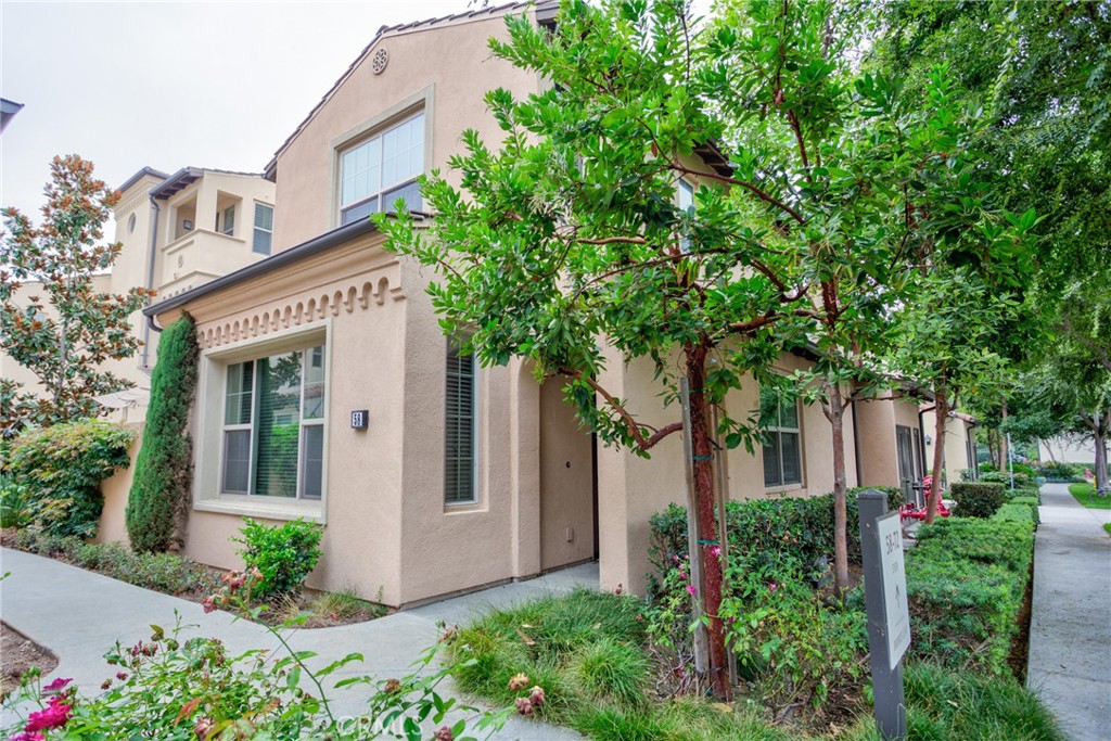Built in 2015 by **California Pacific Homes**, this **turnkey Zinnia Plan X end-unit townhome** is located in the highly sought-after **Cypress Village community of Irvine**. Designed for both comfort and versatility, the home features **4 bedrooms and 3 bathrooms**, including a **main-floor bedroom and a handicap-accessible bathroom**. Flooded with natural light, the open-concept first floor boasts **hardwood flooring**, **recessed lighting**, and a spacious **family room** that flows seamlessly into the upgraded kitchen and dining area. The kitchen is beautifully appointed with **shaker-style cabinetry**, **sleek quartz countertops**, **tiled backsplash**, a **large island with bar seating**, and **stainless steel appliances**. Upstairs, you’ll find three generous bedrooms, including a **primary suite** with a **walk-in closet**, **dual vanities**, and a **large walk-in shower**. The upstairs **laundry area** includes a **stackable washer and dryer** for convenience. Enjoy outdoor living in the **private side yard**—perfect for relaxing or hosting a BBQ. Additional features include a **two-car attached garage** and plenty of guest parking. Residents have access to **resort-style amenities** such as pools, parks, tennis courts, and scenic walking trails, with easy access to major freeways (5/405/133), shopping destinations like **99 Ranch Market, Woodbury Shopping Center, The District, and Irvine Spectrum**, as well as the **Irvine Train Station** and **John Wayne Airport**. Located within **Irvine’s award-winning school district**, this home offers modern comfort, prime location, and low Mello Roos—making it a truly exceptional place to call home.