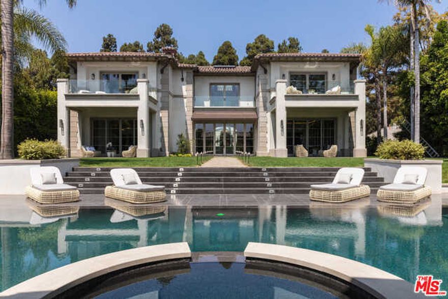 This newly constructed estate is a triumph with incredible custom design elements throughout. A stunning courtyard leads to a light-filled atrium with a retractable glass ceiling and marble arches. Vanishing pocket doors beyond grand-scale living spaces lead to phenomenal outdoor areas. A luxurious master suite boasts dual bathrooms and showroom closets. A lower level holds a theater, auto gallery, gym and staff quarters. A park-like backyard showcases a resort-caliber pool, spa and cabana.