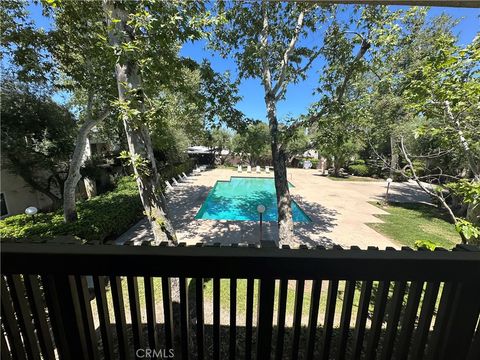 Photo of 23515 Lyons Ave #219, Valencia, CA 91355 (MLS # SR26082475)