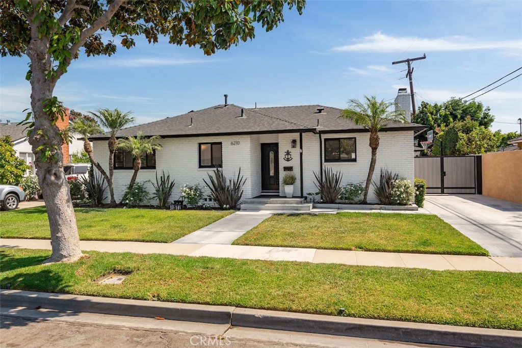 Introducing 6210 E Fairbrook St, perfectly situated on a quiet tree lined street with an oversized lot in the highly desirable neighborhood of Los Altos. Updated and move-in ready, this mid century home has an abundance of style and functionality. As you enter, hardwood floors and natural light guide you throughout the interior. The main living and dining room collaborate for a spacious and inviting setting. Bright and open, the chef’s kitchen is well appointed with stainless steel appliances, ample counter space with storage and a breakfast bar. A rustic brick fireplace adds a touch of warmth to the heart of the home. All three bedrooms are generous in size, including a large primary bedroom and two full bathrooms. Outdoor living is easy in the entertainer’s backyard, complete with built in BBQ, covered patio and putting green. An extended driveway and 2 car garage expand the exterior space while providing privacy and endless possibilities. Additional amenities include an owned solar system, upgraded electrical, central heat & A/C and so much more! Located in the award winning Minnie Gant District and close to shopping, restaurants and the beach. Welcome home!