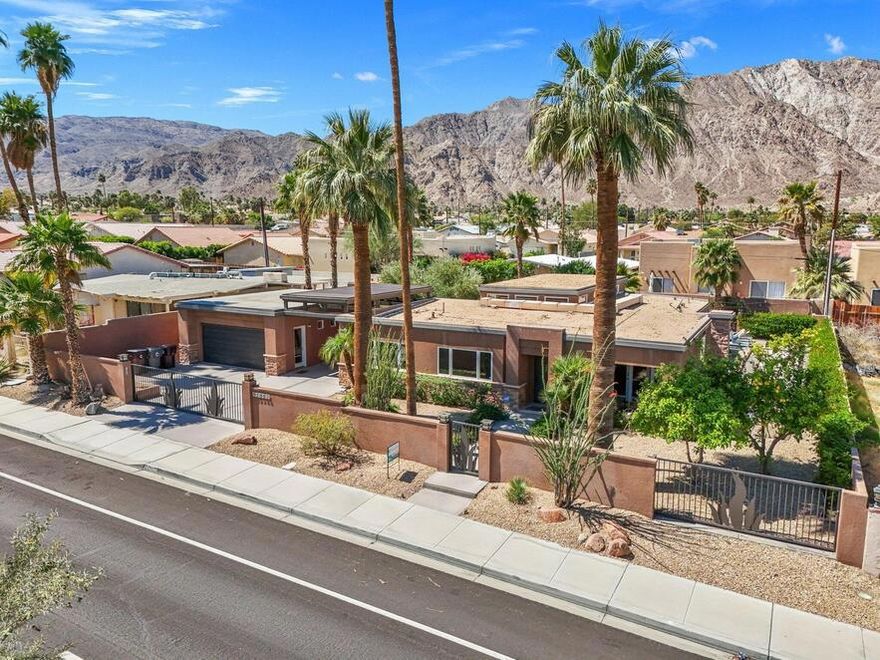 Welcome to your dream retreat in downtown La Quinta! This remarkable **3,064 sq ft** home sits on a **huge double lot**, offering an abundance of space and luxury living. With **five bedrooms** and **four baths**, this home is perfect for families and entertaining guests. A standout feature is the **detached 500 sq ft Casita guesthouse**, complete with a bedroom, full bath, living room, and kitchenette, providing the ideal space for visitors or potential rental income. The property also boasts potential RV access with a gated entry, ensuring convenience for all your recreational needs.Security and privacy are paramount, with a private driveway and garage featuring a security gate with remote access. The main home includes a two-car garage plus an additional golf cart garage, catering to all your parking requirements.Inside, you'll find elegant French doors in each bedroom that open to the enchanting outdoor space, complemented by beautiful travertine flooring throughout. The modern kitchen, designed for both aesthetics and functionality, features updated cabinetry and upgraded stainless steel appliances, making cooking a delight.Step outside to discover a backyard oasis perfect for entertaining and relaxation. Enjoy outdoor fun with bocce ball, a cozy fire pit, a refreshing lap pool, and a spa--all complemented by a built-in barbecue and bar area for alfresco dining.Ideal for outdoor enthusiasts, this home is just a short walk away from hiking and biking trails, as well as the vibrant shops and dining options in downtown La Quinta. Don't miss this opportunity to own a stunning home in a prime location! Schedule your private tour today and experience the perfect blend of luxury and lifestyle!