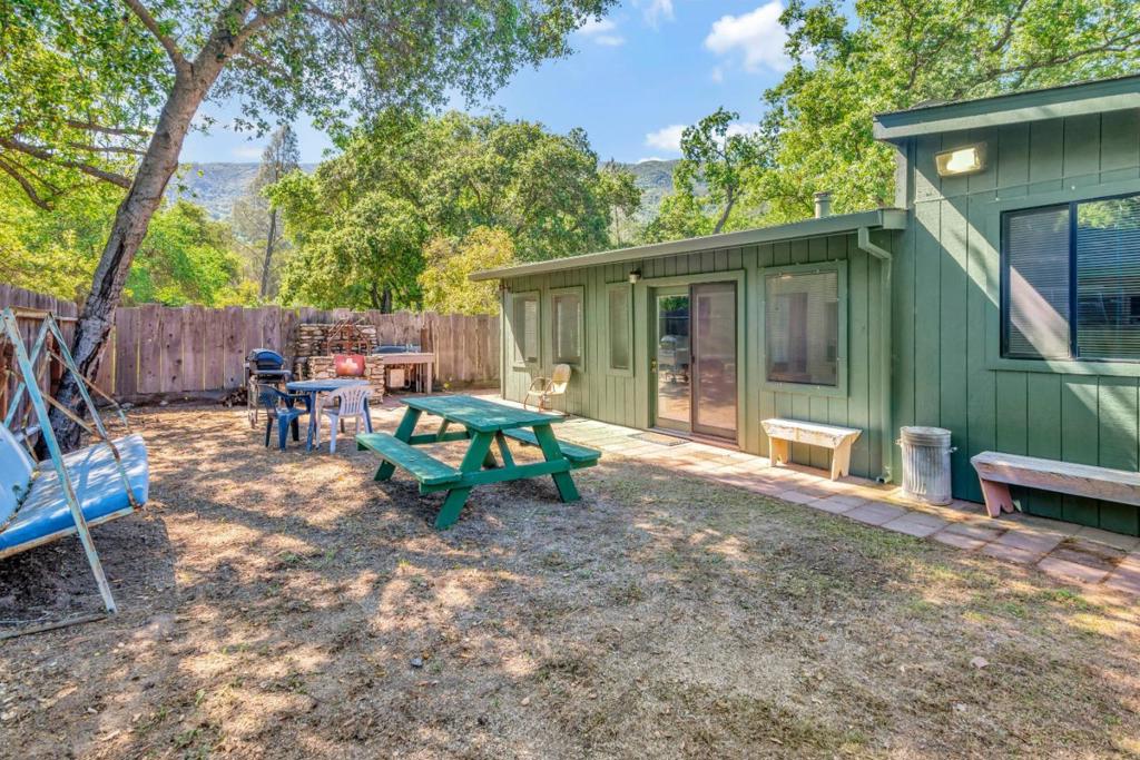 Welcome to your charming cabin retreat nestled near the tranquil Arroyo Seco river and the breathtaking Los Padres National Forest. This cozy cabin is situated on a fully fenced 4,000 sq ft lot, offering both privacy and security in a serene natural setting. Step inside and be greeted by the inviting dining area, centrally located for easy access. Just a few steps up, you'll find yourself in the warm and welcoming living room, perfect for relaxing after a day of outdoor adventures. This cabin features two generous guest bedrooms, providing ample space for family and friends to stay comfortably. A full bathroom adds convenience to this cozy retreat. The spacious kitchen is the heart of the home, equipped with a wood-burning stove to keep you warm during the cooler months while adding to the rustic charm of the cabin. With its proximity to the Arroyo Seco river and the Los Padres National Forest, this cabin is an outdoor enthusiast's dream come true. Whether you're seeking adventure or simply a peaceful escape, this cabin offers the perfect blend of comfort and natural beauty. Don't miss your chance to make this delightful retreat your own!
