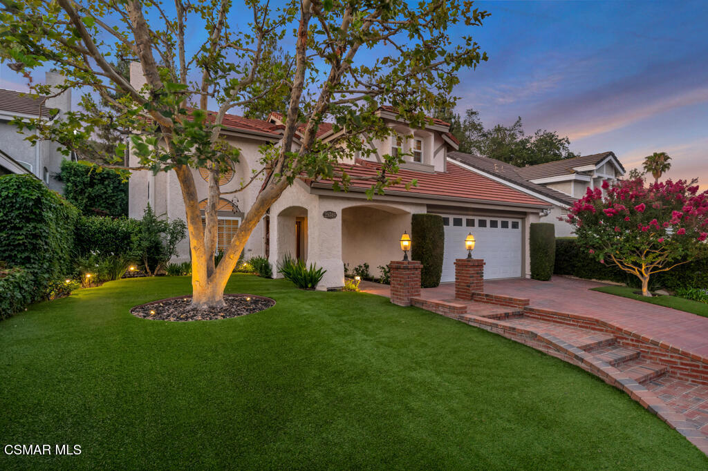 Absolutely Gorgeous! Shows like a model home! Customized Brittany model with upgrades galore. This property is in pristine condition and upgraded with only high-end finishes. Custom Mahogany engineered hardwood floors and remodeled curved wooden staircase with custom banister greet you as you enter this home. The living room has soaring two story ceilings, a glowing fireplace and opens to the large formal dining room. the home features custom base and crown moldings, plantation shutters and extensive use of recessed lighting throughout. This includes spot lighting, art lighting counter lighting and outdoor lighting. the remodeled open concept kitchen includes crisp white shaker cabinets, natural quartzite counters, farmhouse sink and a full complement of stainless steel appliances. Adjacent is a convenient breakfast nook and breakfast bar that open to the cozy family room warmed by a fireplace flanked with built in cabinets and bookshelves. Completing the downstairs isa showstopper remodeled bathroom with a custom marble shower, elegant vanity with designer mirror, wall sconces and full wainscoting. Completing the first floor is a bedroom that is currently being used as an office, a full laundry room and two car garage with epoxy coated floors and custom built in storage. Ascend the curved staircase and you arrive at the tranquil primary suite complete with sitting area, bay window, plantation shutters, dual walk in closets and an ensuite bathroom. The Spa -like primary bathroom includes a deep soaking tub, double vanity, separate shower and vaulted ceilings. Two additional bedrooms and one additional bathroom complete the upstairs.The backyard is designed for entertaining with a refreshing pebble tec pool and spa, built in bar-b-que, covered pergola and beautiful landscaping. All of this in the top rated Las Virgenes School District with nearby Forest Cove Park at your door step. Easy access to great restaurants , hiking and biking trails and a short drive to the beach. Do not miss this home, it will exceed your expectations.