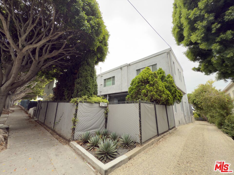 Lease an Iconic Santa Monica Home with Rock & Roll Provenance. Now available for lease: the personal residence of a founder and member of the pioneering band DEVO. Located just blocks from the ocean and steps from Main Street, this singular Santa Monica property blends coastal living with unmistakable creative character.Spanning nearly 3,000 square feet, this three bedroom, four bathroom home was originally a multi-unit property and has been converted into a dynamic single family retreat. The layout is flexible and expansive, with multiple indoor living spaces, a light-filled kitchen with island and bar seating, and a series of warm, welcoming areas for both relaxation and entertaining. The interiors are quirky, expressive, and full of soul. This is not a conventional home, and that's exactly the appeal.Outside, the property delivers serious lifestyle value. A lap pool and spa are surrounded by mature landscaping and total privacy. There's a wood-burning pizza oven, grill, and multiple outdoor dining and lounge areas that feel made for long afternoons and get togethers. A long driveway provides off street parking for several vehicles, along with a three car carport tucked away at the back of the property.Creative, layered, and unapologetically unique, this is a rare opportunity to lease a home with personality and pop culture pedigree just minutes from the sand and everything Santa Monica has to offer