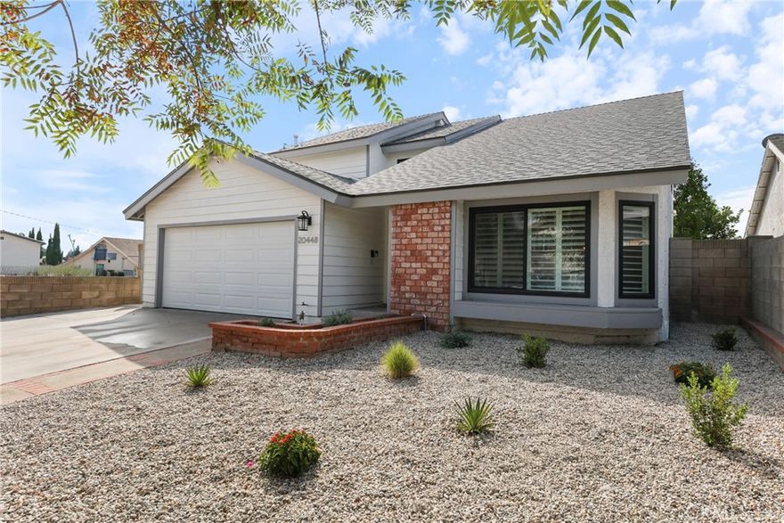 Come and see this stunning five-bedroom, three-bathroom home offering over 2,700 square feet of beautifully updated living space. Perfectly designed for comfort and functionality, this home is truly move-in ready and ideal for today’s modern lifestyle.  Step inside to a bright and spacious layout featuring a renovated kitchen complete with newer stainless steel Samsung appliances, new cabinetry, and elegant Quartz countertops. Two of the three bathrooms have been completely remodeled, showcasing modern fixtures, stylish vanities, and matching Quartz finishes for a cohesive designer look.  The thoughtfully designed floor plan includes one bedroom and a full bath downstairs—perfect for guests, a home office, or private workspace. The spacious living room opens to a formal dining area, while the cozy family room—complete with a beautiful fireplace—flows seamlessly into the sunny kitchen with a built in Island. Upstairs, the oversized primary suite features a walk-in closet and a luxurious private bath with a separate tub and shower. As if that weren't enough, energy efficiency and comfort abound with newer dual-paned windows with custom shutters, a 2-year-old HVAC system, and a 3-year-old water heater. The home also features an upgraded electrical panel, a newer roof for added peace of mind. Thousands have been spent to prepare this home for its new owners. With its blend of modern upgrades, generous space, and a warm, inviting feel, this property truly stands out as a must-see.