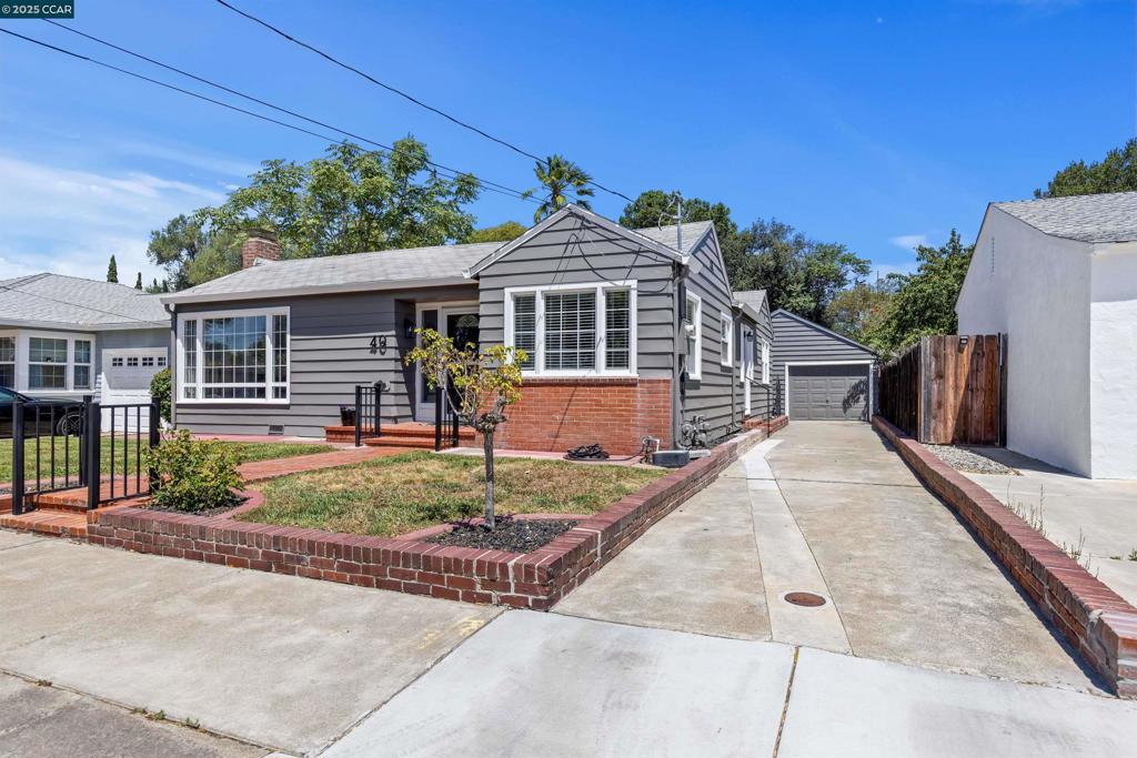 This unique custom home was thoughtfully designed to blend style and functionality. Nestled on a delightful dead-end street, this spacious 2-bedroom 1-bath plus bonus room offers 1,345 square feet of living space plus an easy ADU conversion opportunity. The flawless open floor plan invites you into a large living room, complete with a cozy fireplace and abundant windows that flood the space with natural light. Enjoy tranquil views of the private courtyard, an ideal setting for relaxation. The kitchen is a chef's dream with ample storage cabinets, tile countertops, and a charming breakfast nook. The two generously sized bedrooms are complemented by a large bathroom featuring an extended vanity plus a make-up station and extra storage. Desirable features include parquet wood flooring beneath the carpets, dual-pane windows throughout, and a spacious laundry room with a storage closet and utility sink. The extra-long driveway leads to the oversized detached garage already equipped with a sink and plumbing for a potential toilet hookup and a large bonus room offering potential for an ADU conversion or home business. The outdoor space features multiple entertaining zones. Whether enjoying the private courtyard, the covered patio, or the low-maintenance backyard with no rear neighbors.