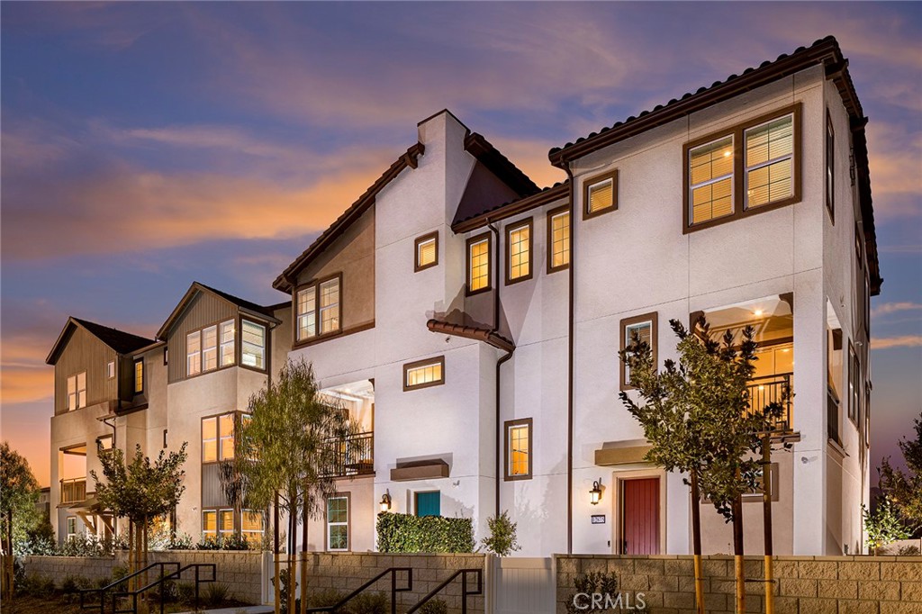 PRICE IMPROVEMENT! Welcome to Pearl at Eastvale Square and this amazing thoughtfully designed home. The first floor offers a spacious two-car attached garage with ample storage and a welcoming entryway. As you ascend to the second floor, you'll discover the heart of the home—an open-concept living space featuring a gourmet kitchen with a large island, plenty of counter space, and a dining area perfect for gatherings. The adjoining living room seamlessly extends to a covered deck, creating a perfect blend of indoor and outdoor living. A convenient powder room completes this level. The third floor is dedicated to relaxation, with two well-sized bedrooms sharing easy access to a full bath, while the primary suite offers a private ensuite bath for ultimate comfort. With an enclosed front entry and modern finishes throughout, this home delivers both functionality and sophistication—an exceptional urban retreat that’s move-in ready! Our fantastic community amenities are set to be ready by early 2026, and they’re sure to enhance your lifestyle! Imagine soaking up the sun by the sparkling pool or relaxing in the soothing spa after a workout in the modern fitness center. Little ones will love the playful kids’ playground, while adults can gather at the charming clubhouse. Enjoy delightful outdoor spaces complete with BBQ grills and cozy firepits, perfect for evenings with friends and family. Explore the expansive green areas for picnics, let your furry friends roam in the dog park. And don’t forget the half basketball court for some friendly competition! With beautiful paseos connecting the neighborhoods, every stroll will be a joy. Adventure and relaxation await you in this vibrant community! Don’t miss out on this incredible opportunity to be part of Eastvale’s newest destination!