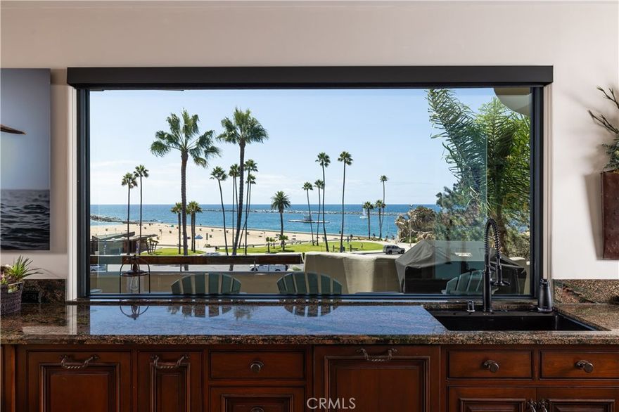 This is a unique opportunity to indulge in luxurious coastal living and enjoy breathtaking, unobstructed views of the Pacific Ocean and Newport Harbor from every room. Situated on prestigious Ocean Boulevard, this fully furnished oceanfront home blends a masterpiece of timeless, upscale charm with modern sophistication.



Enter this hidden bluff-top estate via a gated private driveway, providing a direct pathway to the rooftop entertainment deck with built-in bar, two fire pits, and a private powder room. The home’s expansive and open concept, with access to the outdoors from every room, provides an abundance of natural light and seamlessly blends indoor and outdoor living.



The great room, living room, fully appointed chef’s kitchen, and dining area all open to the main terrace, equipped with outdoor heating, electric awnings, and barbecue. Perfect for relaxing and entertaining.



The main level includes the stunning primary retreat with a sitting area, fireplace, oversized walk-in closet, spa-style bath, steam shower, and infrared sauna. The lower level offers two very spacious bedrooms each with ensuite baths. Additionally, with a separate entrance, the studio apartment is complete with a full kitchen and bath ideal for executive office or out-of-town guest.



This home provides a gate from the backyard just steps to Pirates Cove, the state park, and beach. A pleasant walk over the Goldenrod bridge will take you into the charming village of Corona Del Mar which is full of shops and great local restaurants. Ideally located, we are a short drive from world-class shopping at Fashion Island and South Coast Plaza, only 7 miles from John Wayne Airport, and easy access to freeways.



This fully-furnished residence is an exceptional choice for those who are in transition or looking to immerse themselves in one of Southern California‘s most exclusive communities.