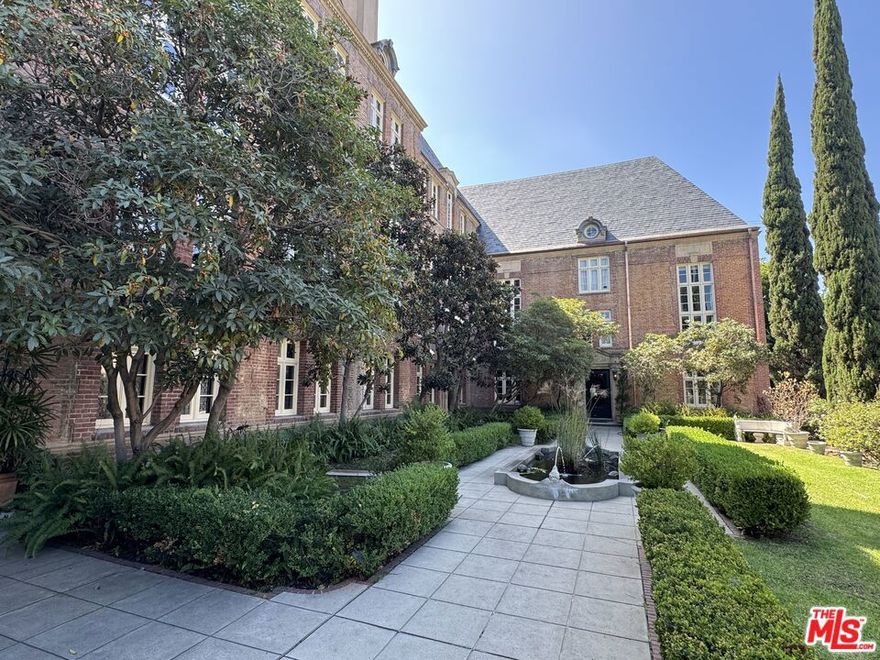 Designed by architect Leland Bryant and built in 1928, La Fontaine is West Hollywood's most iconic residential building and is the epitome of Golden Age Hollywood Glamour. This large 2 bedroom unit features a full formal dining room, decorative fireplace, hardwood floors, formal entry foyer, Gothic arches, original tile, separate tub and shower and other period details. The French Normandy brick building features an entry garden with legendary fountain in front, community laundry room, secure entry, and on-site manager. Close to major banks, post office, Whole Foods, Trader Joes, Crunch, City Yoga, movies, shopping, restaurants, and nightlife. This is a sensational urban home in a great community. Secure parking spot
