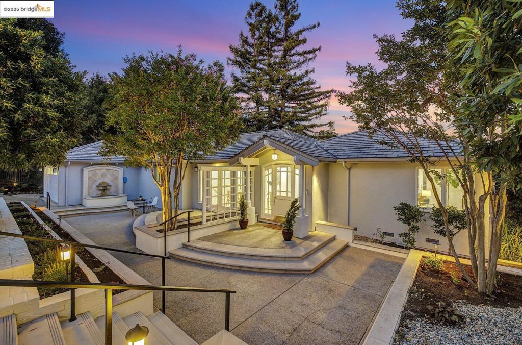 Gated and private with sweeping views, 15 Los Dedos has been extensively and sleekly upgraded over the past year. Nestled in the desirable Orinda Country Club neighborhood, the ~3,000-sq ft residence features four bedrooms and 3.5 baths across an airy, open floor plan. Light pours into open living, lounging, and dining areas. The professionally designed chef's kitchen connects seamlessly to the dining room and showcases custom cabinetry, and high-end appliances. The living room centers on a gas fireplace with porcelain surround, while the family room boasts bespoke built-in storage, a wine fridge, and wall of glass that opens to a deck with dramatic outlooks. The main level includes the primary suite with a marble bath and dual walk-in closets, a secondary bedroom, and a show-stopping powder room. Downstairs, find two additional bedrooms—one with built-ins and Murphy bed, the other with an ensuite bath—plus a hall bath, laundry, storage, and a versatile bonus room. Polished, private, and brimming with designer details, this Orinda gem also offers custom closets, a walk-in pantry, and well-tended outdoor spaces. Just minutes from BART, top-rated schools, trails, restaurants, and shopping. This is modern living at its best.