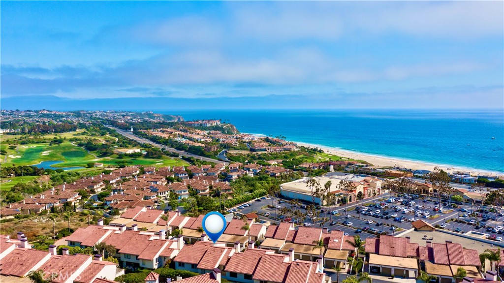 Located in the prestigious enclave of Monarch Beach within the secluded gated community of Monarch Bay Villas, this remarkable ocean-view end-unit villa has recently undergone an extensive and meticulous renovation from top to bottom including new PEX piping, sliding glass doors, new duct & heating system, water heater, recessed lighting, new air conditioner, top of the line whole house water filtration system, Insta Hot water system, new kitchen, new baths, wide plank flooring, custom closets throughout, custom window coverings throughout, new decks, fencing, hard and soft scape, landscaping, irrigation, new fencing and much more. The spacious living room serves as a captivating focal point with its lofty wood-beamed ceilings, inviting fireplace, and, notably, the allure of the large private balcony offering refreshing ocean and golf course views. The expansive gourmet kitchen showcases elegant custom cabinetry, quartz countertops, a large island at its center, and top-of-the-line built-in appliances, including a 42" refrigerator, dishwasher, gas range & oven, disposal and trash compactor. Just off the kitchen, enjoy some downtime in the family room or embrace the indoor-outdoor lifestyle on the well-appointed private patio awaiting you with hard and soft scaping and private hot tub. Upstairs, the primary suite offers a private ocean view balcony. The home boasts white water views of Salt Creek Beach as well as Catalina Island to the Dana Point headlands, the iconic Monarch Beach Golf Links the oceanfront golf course designed by premier golf course architect Robert Trent Jones Jr., majestic landscapes of two world-class luxury resorts—the Ritz Carlton and the Waldorf Astoria. An oversized 2 car garage has built in storage cabinets and a large separate storage closet and an EV charger. The Monarch Bay Villas community provides direct trail access to the Salt Creek Trail, Waldorf Astoria, a variety of restaurants, cafes, salons, fitness facilities, and shopping destinations at the nearby Monarch Bay Plaza. All residences within Monarch Bay Villas received a new clay tile roof and freshly painted exteriors in 2022. Whether you seek a primary residence or an enchanting vacation retreat, this extraordinary opportunity invites you to own your slice of coastal paradise in the hidden gem of Monarch Bay Villas. Community amenities include a private pool, spa, clubhouse, billiards room, fitness room, dry sauna, restrooms, open green spaces and barbecue area.