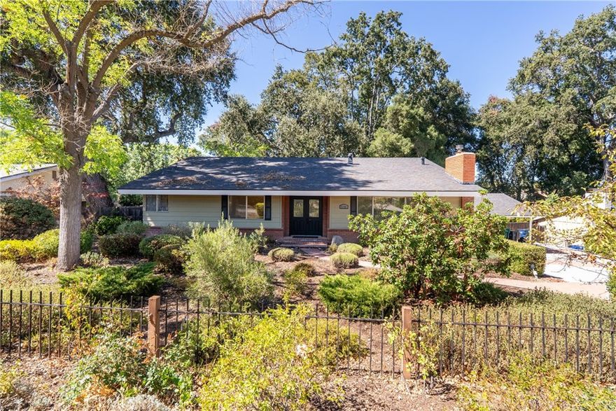 This well maintained 3 bedroom, 2 bathroom residence offers 2100 sf of living space on a serene ~ 0.36 acre lot, combining charm, privacy and modern updates in a prime Atascadero location, right down the road from the Atascadero Lake and Zoo. From the moment you arrive, you’ll be drawn in by the home’s wonderful curb appeal, setting the tone for the warmth and character found throughout. Step inside to find vaulted ceilings that create a bright, airy atmosphere. The spacious living room features large picture windows that flood the space with natural light, along with a cozy wood-burning stove—perfect for cool Atascadero evenings. The kitchen has been updated with granite countertops, open shelving and a walk-in pantry, offering a practical and efficient layout. Upstairs, you’ll find two guest bedrooms, each with sliding glass doors leading to a private deck overlooking the tranquil backyard. The main bathroom boasts a large walk-in shower, while the primary bedroom features dual closets and its own access to the deck—your own private retreat. Downstairs, a cozy family room offers built-in bookshelves with additional storage and a convenient second bathroom with direct access to the backyard—perfect for guests or outdoor entertaining. Step outside to truly unwind. The expansive backyard is lined with mature oak trees, creating a peaceful, private oasis. Enjoy dining al fresco or hosting friends on the large brick paver patio, complete with built-in benches for extra seating. Located near Atascadero Lake Park, with its year-round events and recreational opportunities and just minutes from downtown and freeway access, this property offers a comfortable and connected lifestyle in a charming neighborhood setting. Please review the Virtual Tour for additional information.