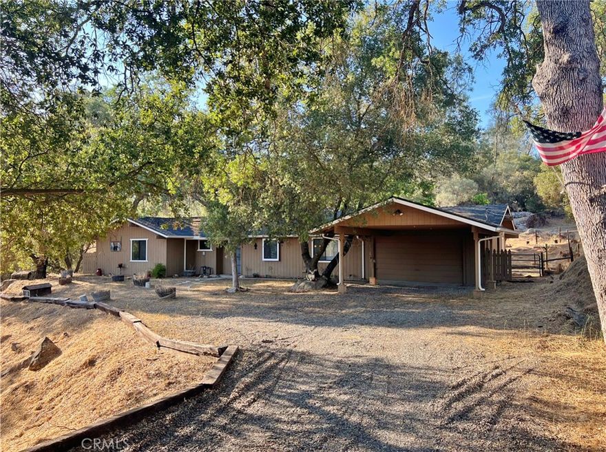 Professional Frisbee Disk Golf Course with a Custom Home included! This Challenging Course Skirts the outer boundaries of this Amazing 1.51 acre Rolling Parcel, studded with Awesome Granite Rock outcroppings, Magnificent Manzanitas, Majestic Oaks and Pines. After you challenge both yours and your friends Disk throwing Prowess and stamina completing a couple Rounds on the Course, head back to the Casa and Relax with a Cool Fresh Beverage as you treat your friends to a BBQ on the huge Covered Rear Patio. This Darling 1560 sq ft 2 bed 2 bath home sits near the end of a Quiet Cul de Sac and is conveniently located near Schools and local shopping, is less than a 30 min commute to North Fresno, 40 min to 3 Recreational Lakes (Bass, Millerton and Hensley) and 1 hour to the Gate of Yosemite. The home features a very inviting open floor plan that consists of a wonderful Great-room with Wood Stove to warm you on those Chilly winter nights, a Super Kitchen with beautiful Custom Cabinets, Granite counters, and large breakfast bar that adjoins the dining area. The guest bedroom and bath are the perfect size for short term stays of family and friends, but then... there is the Master Suite! This Bed and Bath area is like entering your very own exclusive vacation resort with all the bells and Whistles. You will never want to leave! In addition, there's a detached Casita complete with heat and air, a perfect private office or hobby room, a 2 car garage and a carport. Don't Miss Out!