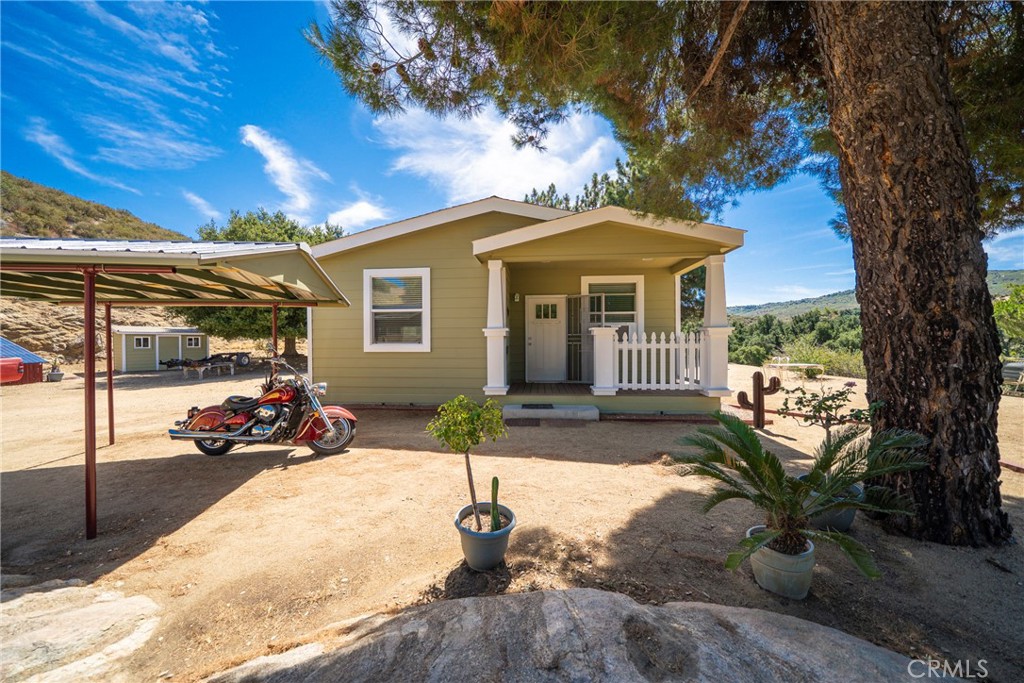 Welcome to your serene retreat in the heart of Banning! Impeccable conditions manufactured home on permanent foundation built in 2015! breathtaking mountain views, this 3-bedroom, 2-bath home offers the perfect blend of modern comfort and country charm with an open layout. Recently painted, this beautifully maintained home features an inviting open-concept layout, highlighted by crown molding throughout for an elegant touch. 17,000 dollars of paid off solar panels with DC power that can be converted into AC easily! Beautiful long and easy drive way off the main road which give it privacy and no noise! The spacious kitchen flows seamlessly into the dining and living areas, creating the perfect space for gatherings. Enjoy the peace and privacy of your expansive lot — ideal for gardening, outdoor entertaining, or simply soaking in the panoramic scenery. Detached Storage rooms for convenience With its great condition, natural light, and stunning surroundings, this home is move-in ready and waiting for you to make it your own!